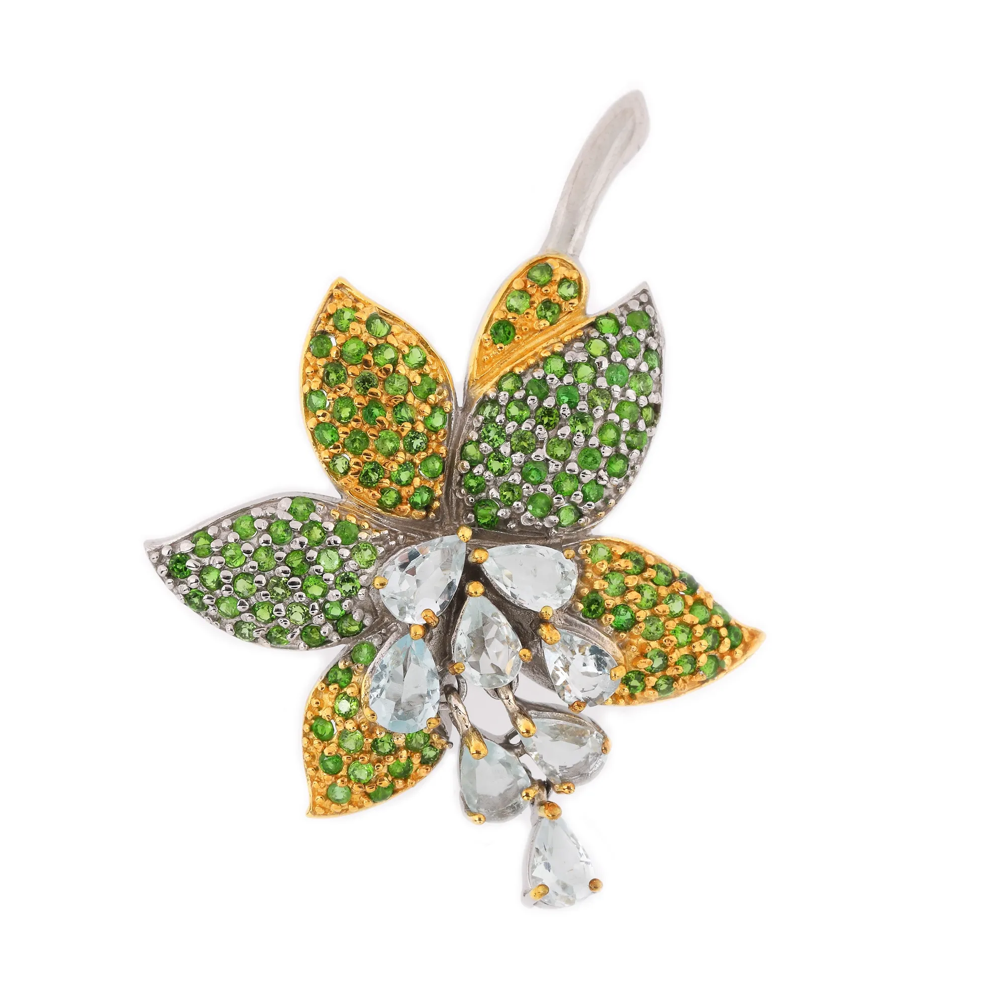 Silver brooch decorated with topazes and chromdiopside
