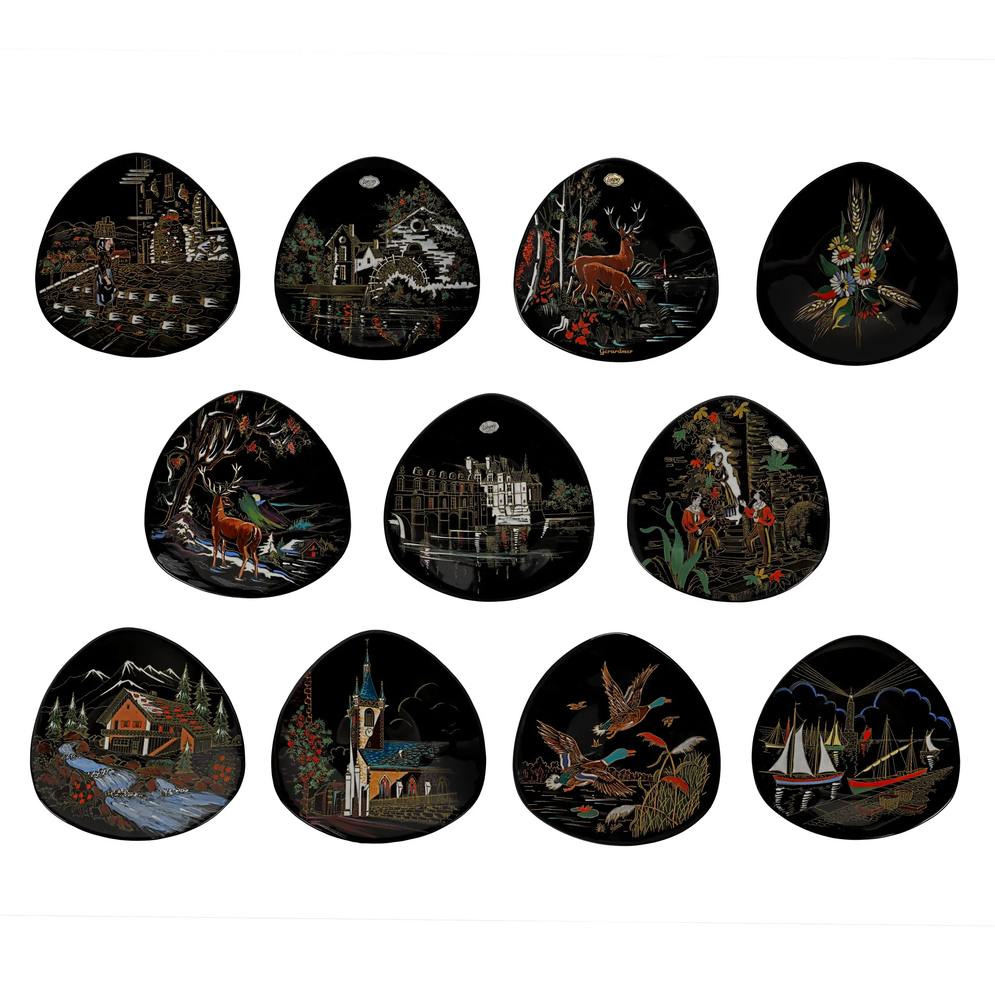Set of 11 Longwy plates decorated with rural scenes, landscapes, and floral motifs