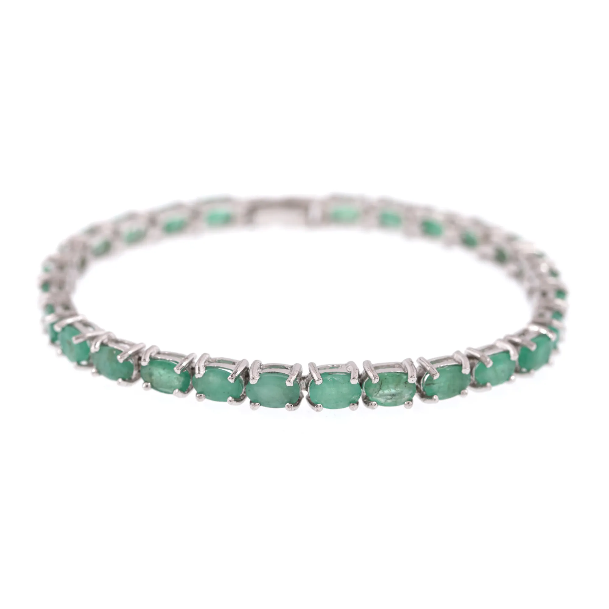 Silver bracelet, decorated with emeralds