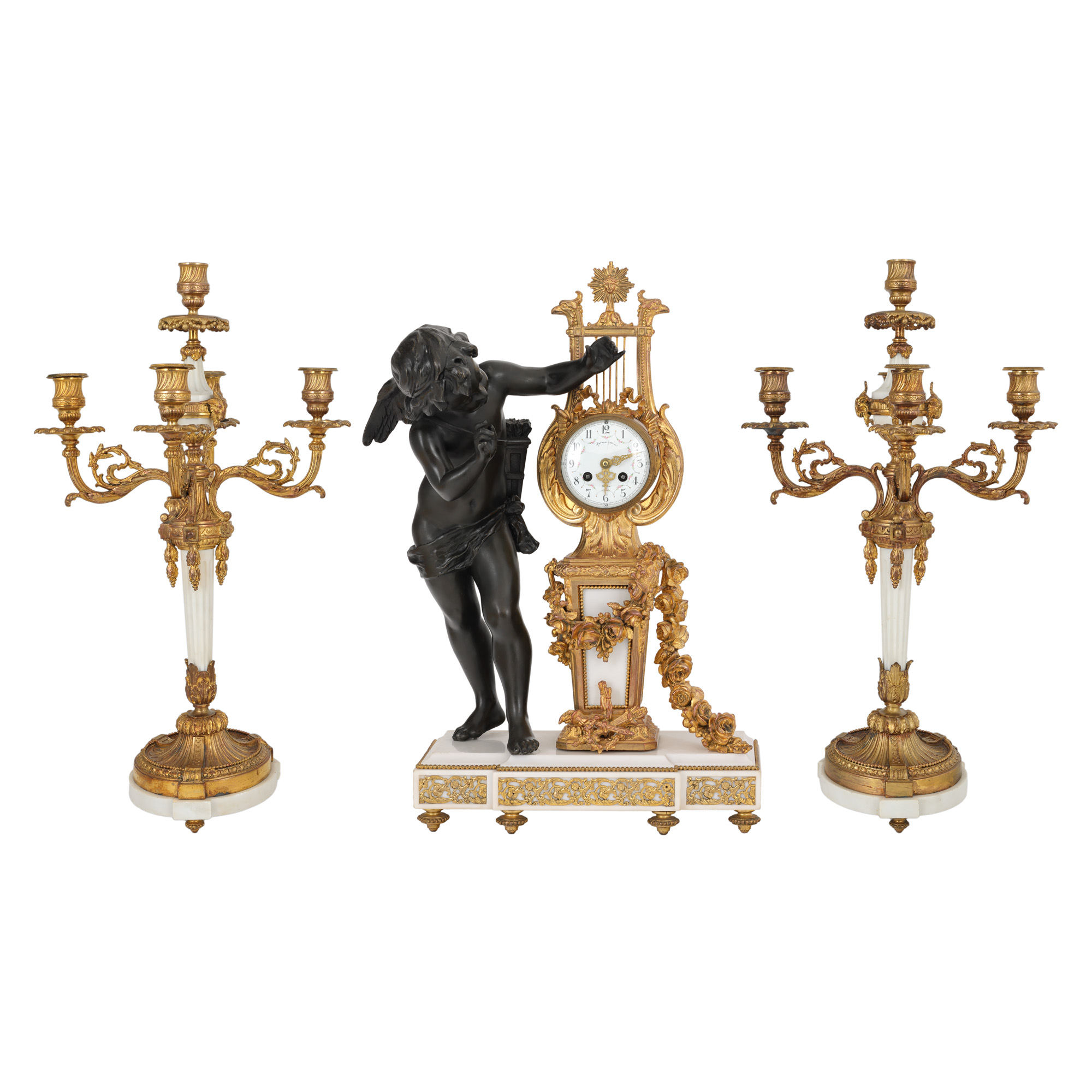 Impressive Empire style fireplace set, consisting of a clock with Peyron Castille mechanism and a pair of candlesticks, end of the 19th century.