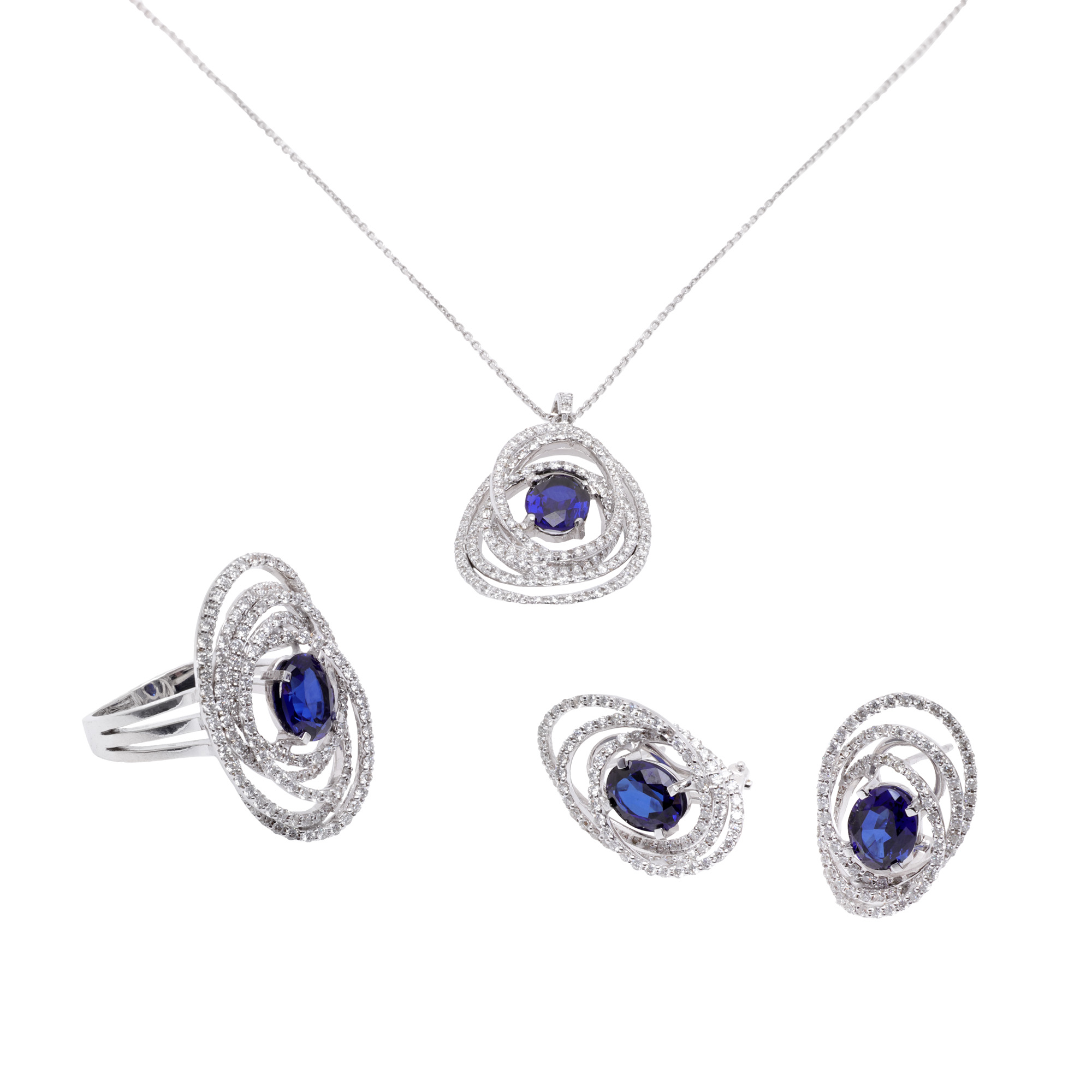 White gold set, decorated with diamonds and sapphires, consisting of a pendant chain, earrings and ring