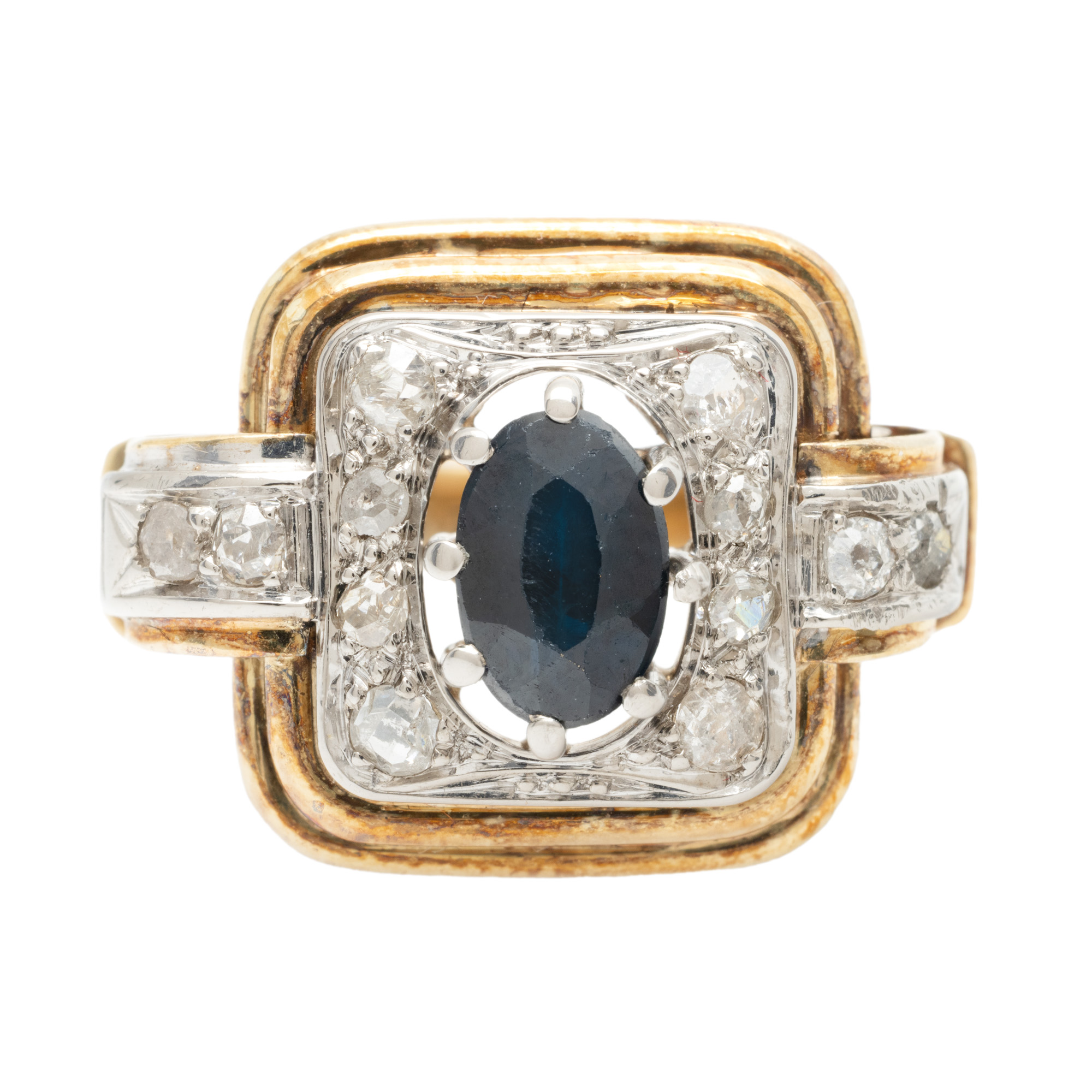 Bicolor gold ring, decorated with sapphire and a entourage of diamonds