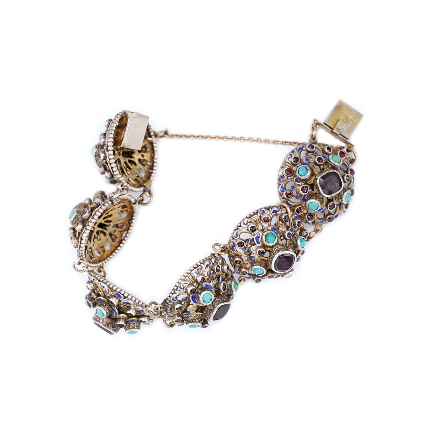 Bracelet of gold and silver, richly decorated with garnets and turquoises