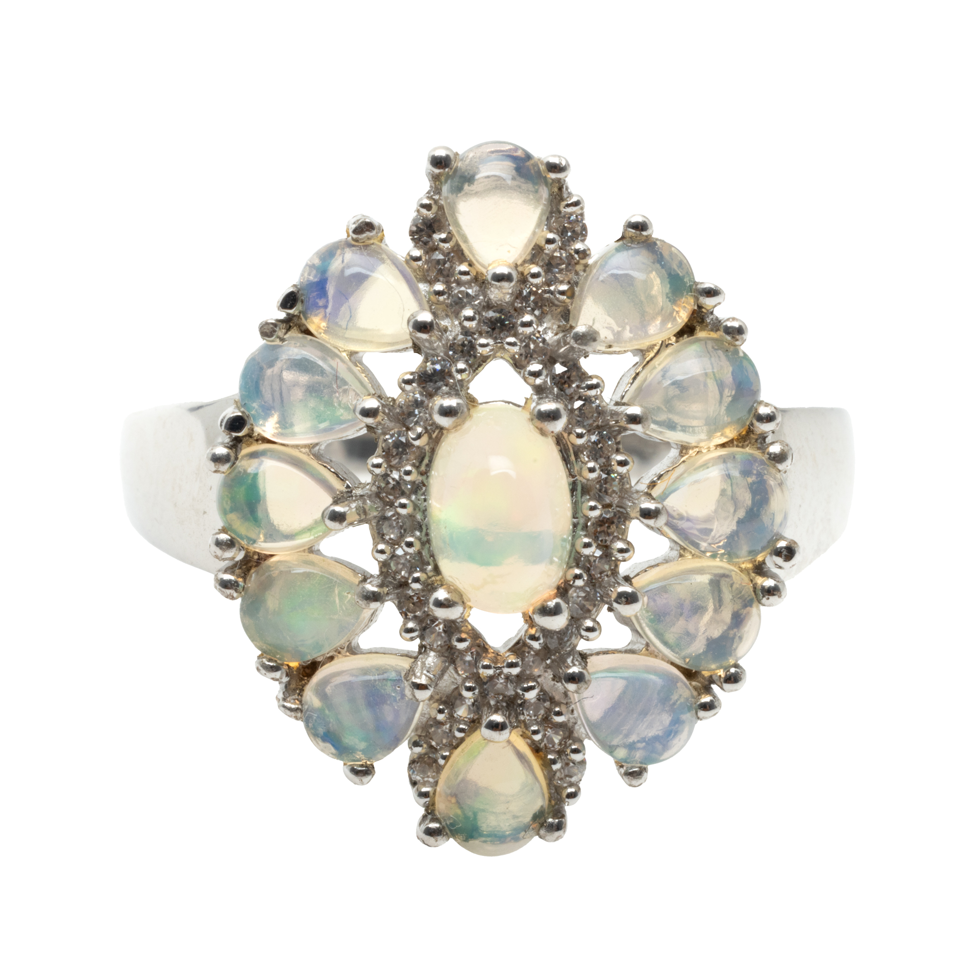 Silver ring decorated with opals and zircon