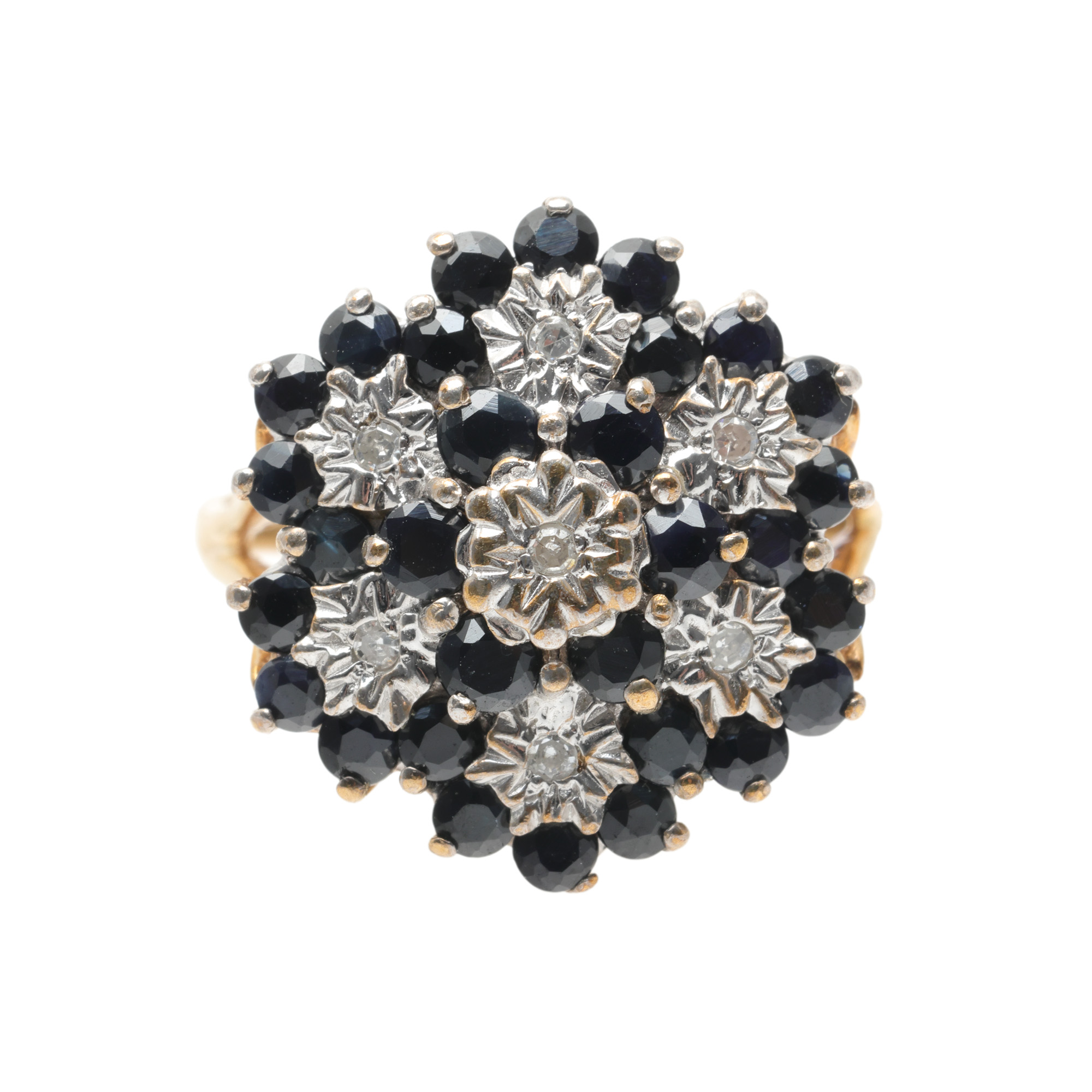 Gold ring, decorated with sapphires and diamonds arranged in a floral pattern