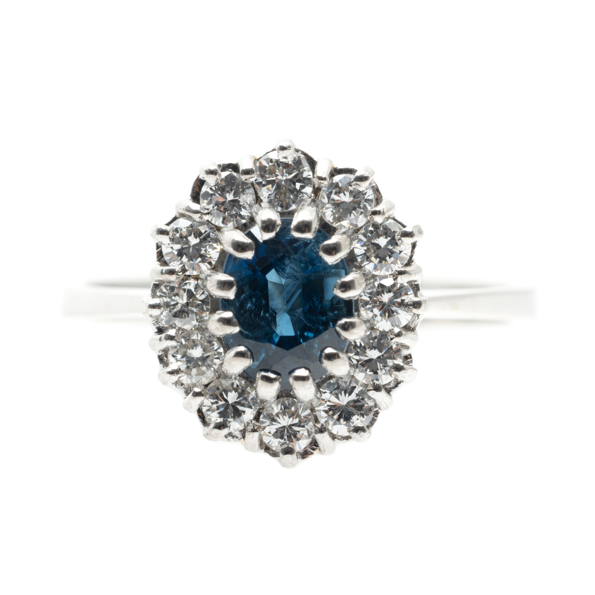 White gold ring, decorated with sapphire and diamonds