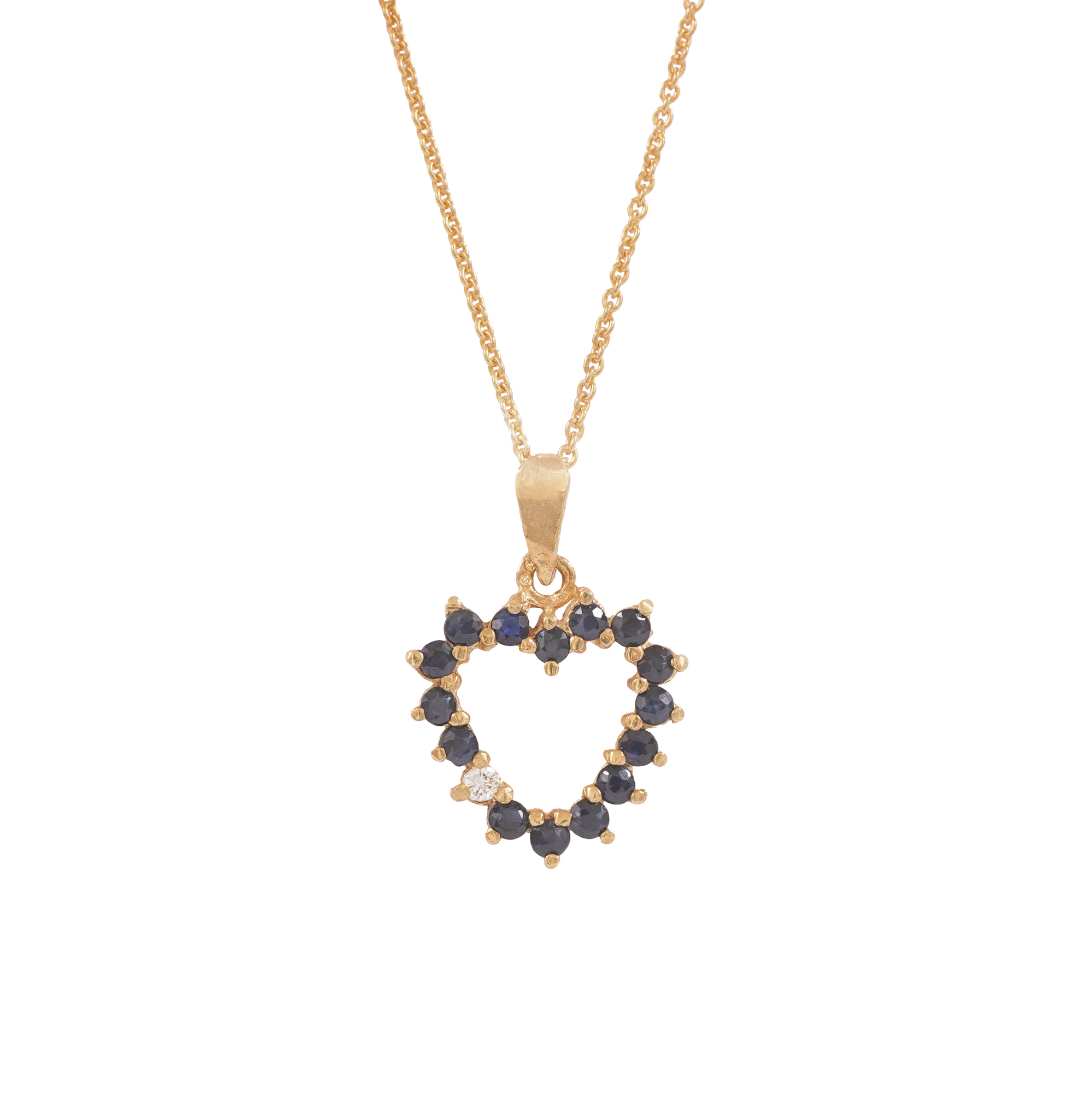 Gilded silver heart-shaped medallion, decorated with sapphires and diamond