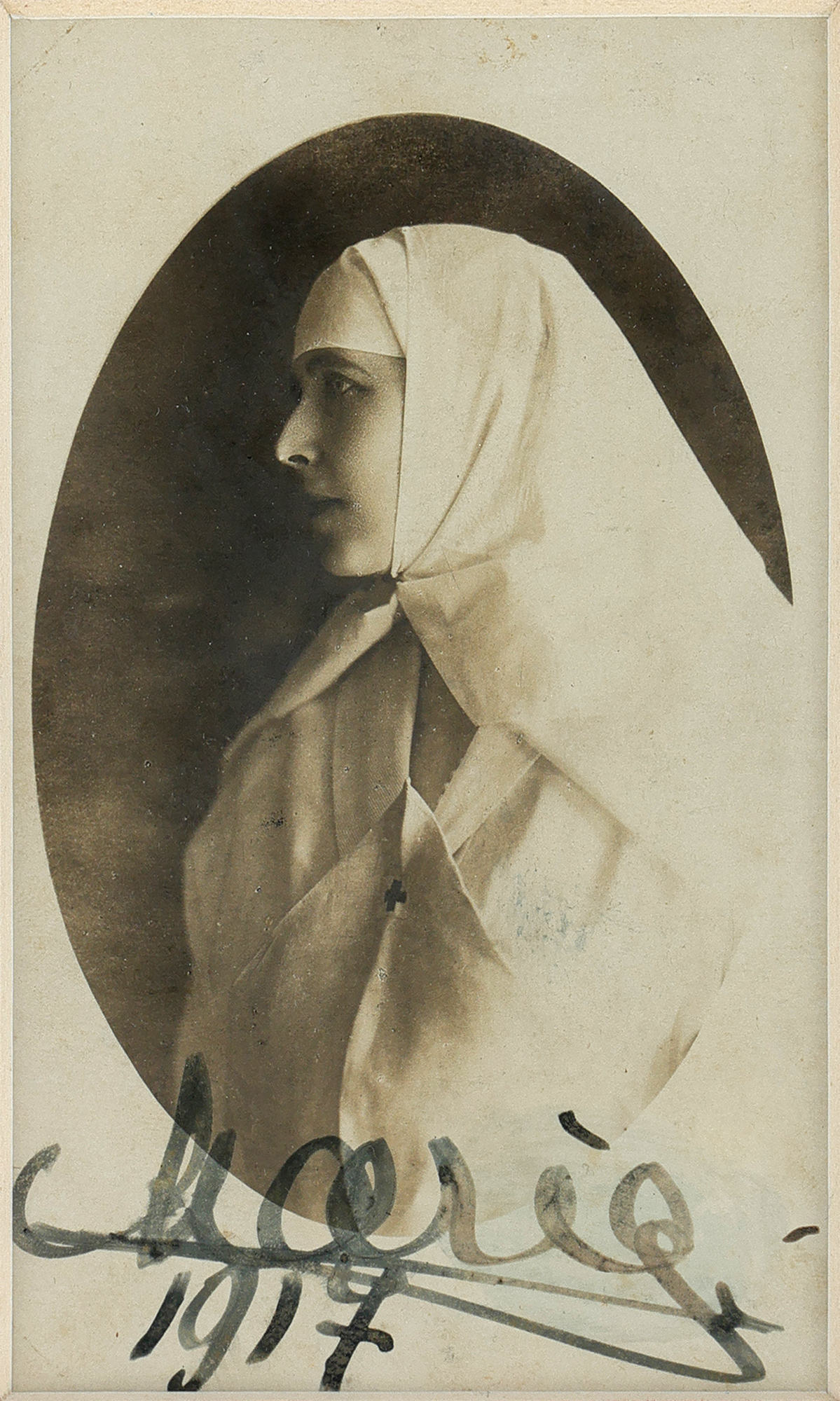 Photograph illustrating Queen Maria, medical sister in the Great War, with her holograph signature, 1917