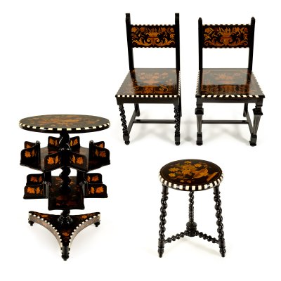 Impressive set composed of revolving library table, two chairs and a stool, made of ebonized exotic wood and ivory inlays, 19th century