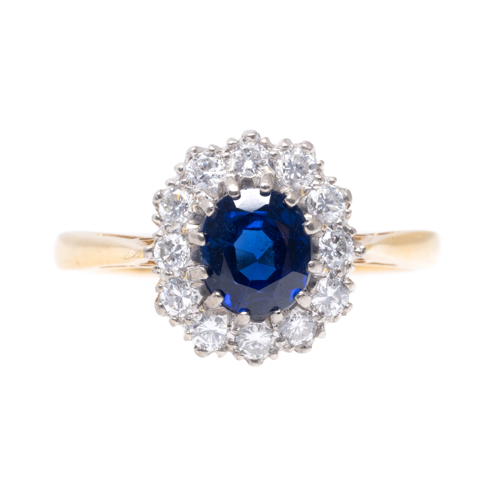 Inel din aur, decorat central cu safir anturat de diamante