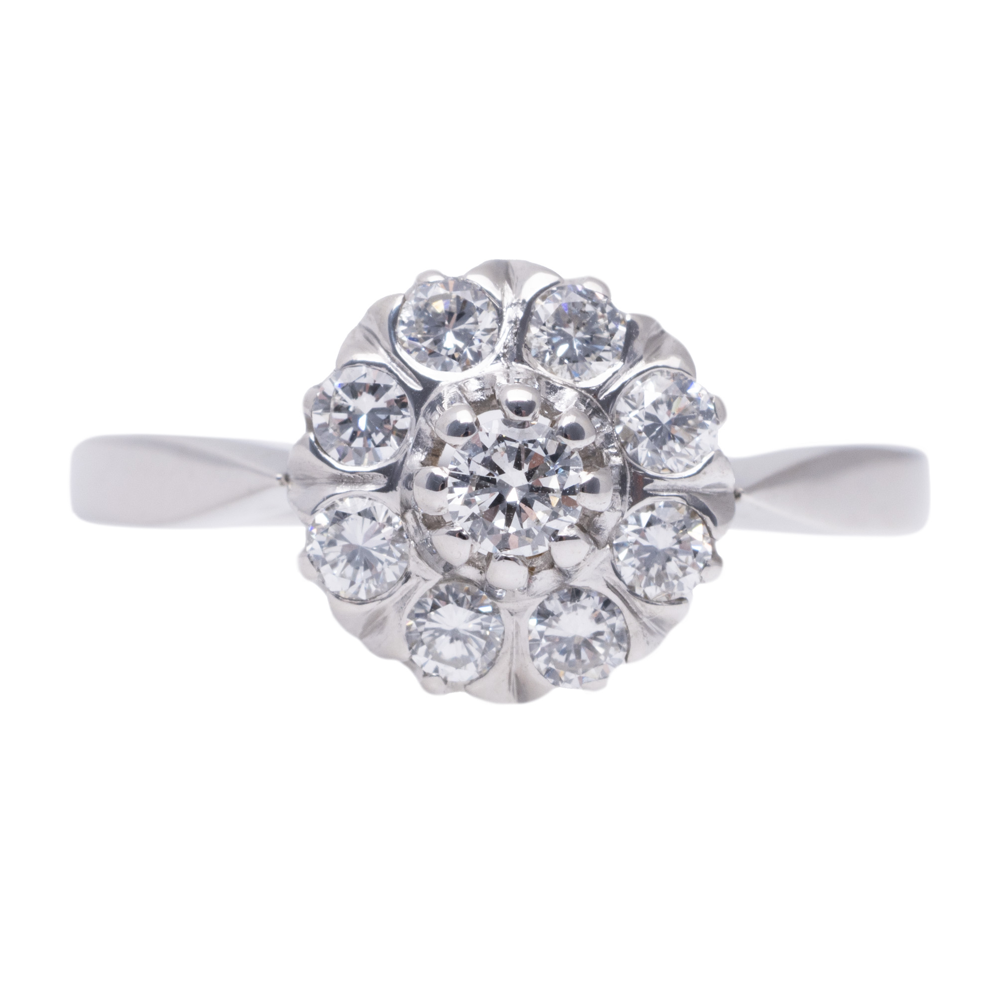 White gold ring, decorated with diamonds arranged in a floral pattern