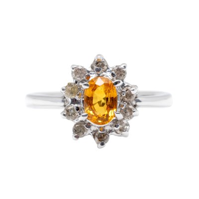 White gold ring, centrally decorated with orange sapphire and diamonds, accompanied by additional gemological certificate