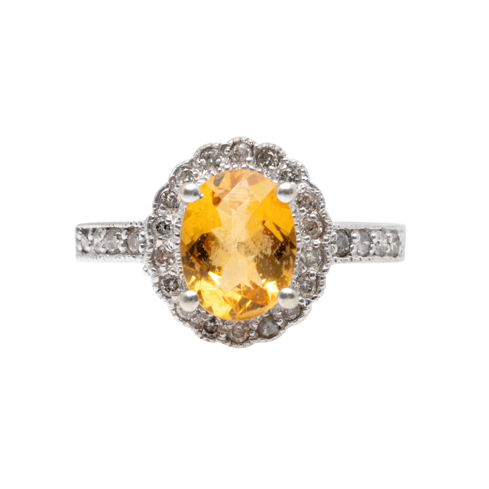 White gold ring, decorated with a citrine surrounded by diamonds
