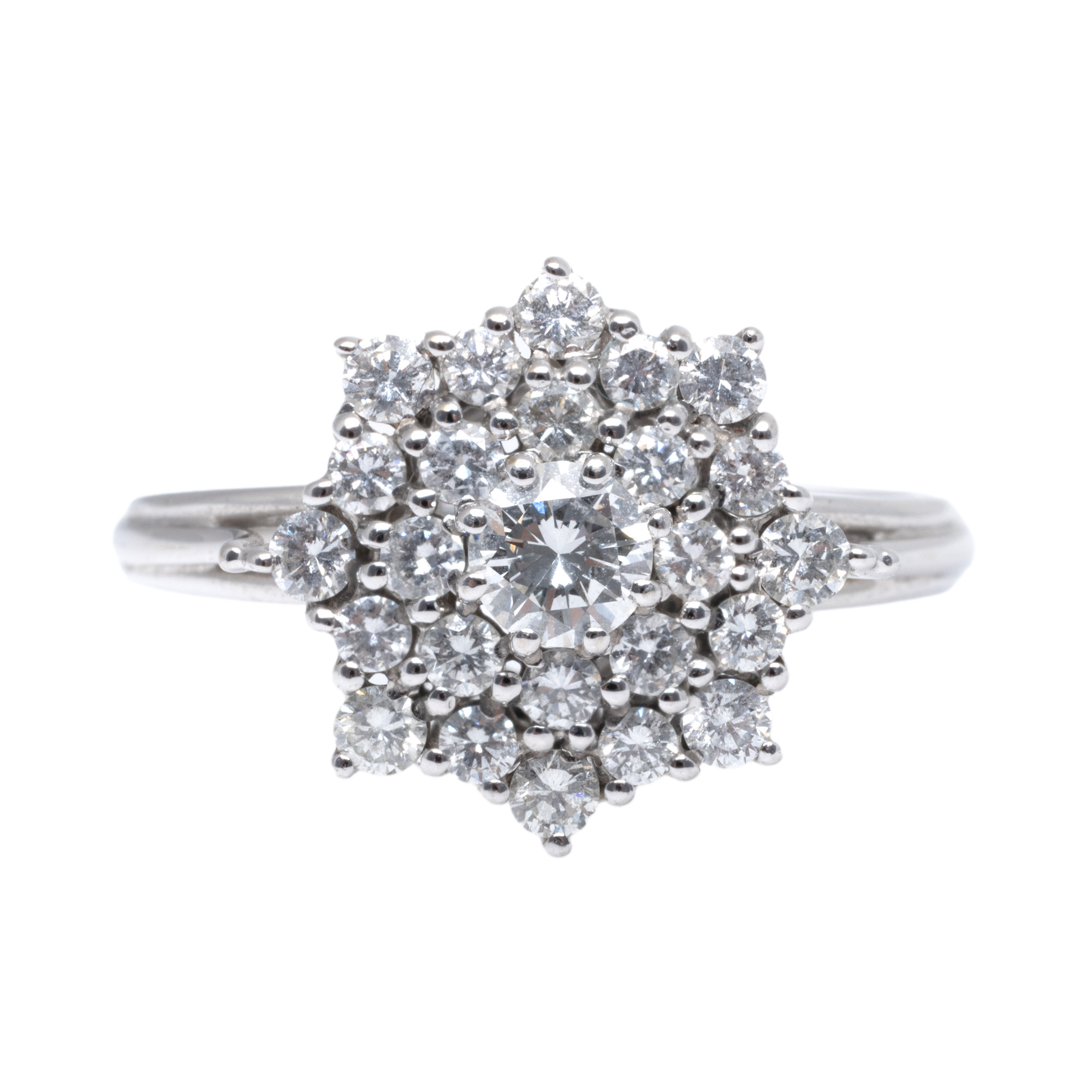 White gold ring, decorated with diamonds arranged in a floral pattern