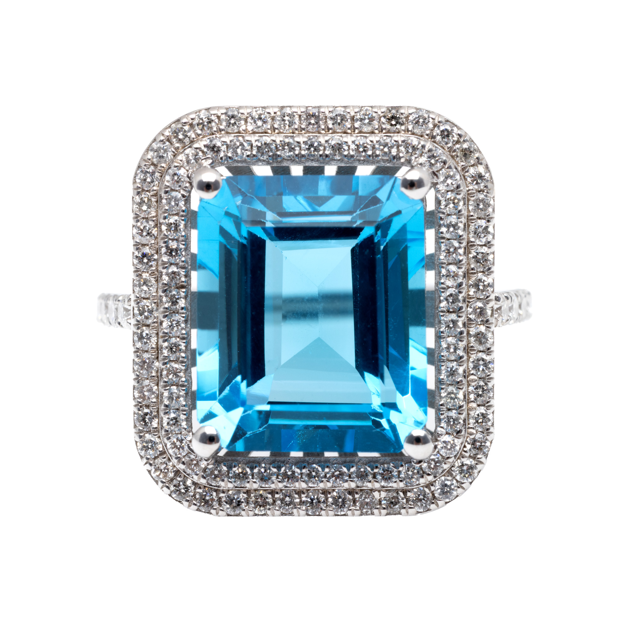 White gold ring, decorated with London Blue topaz, surrounded by diamonds