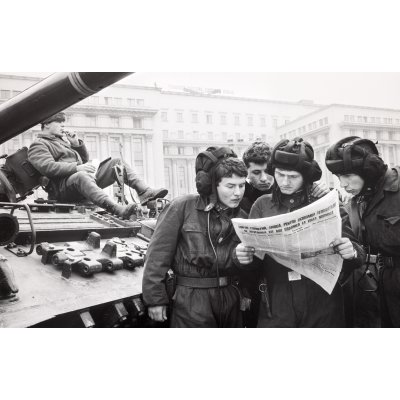 Reading The First Free Newspaper Near Sherman Tank