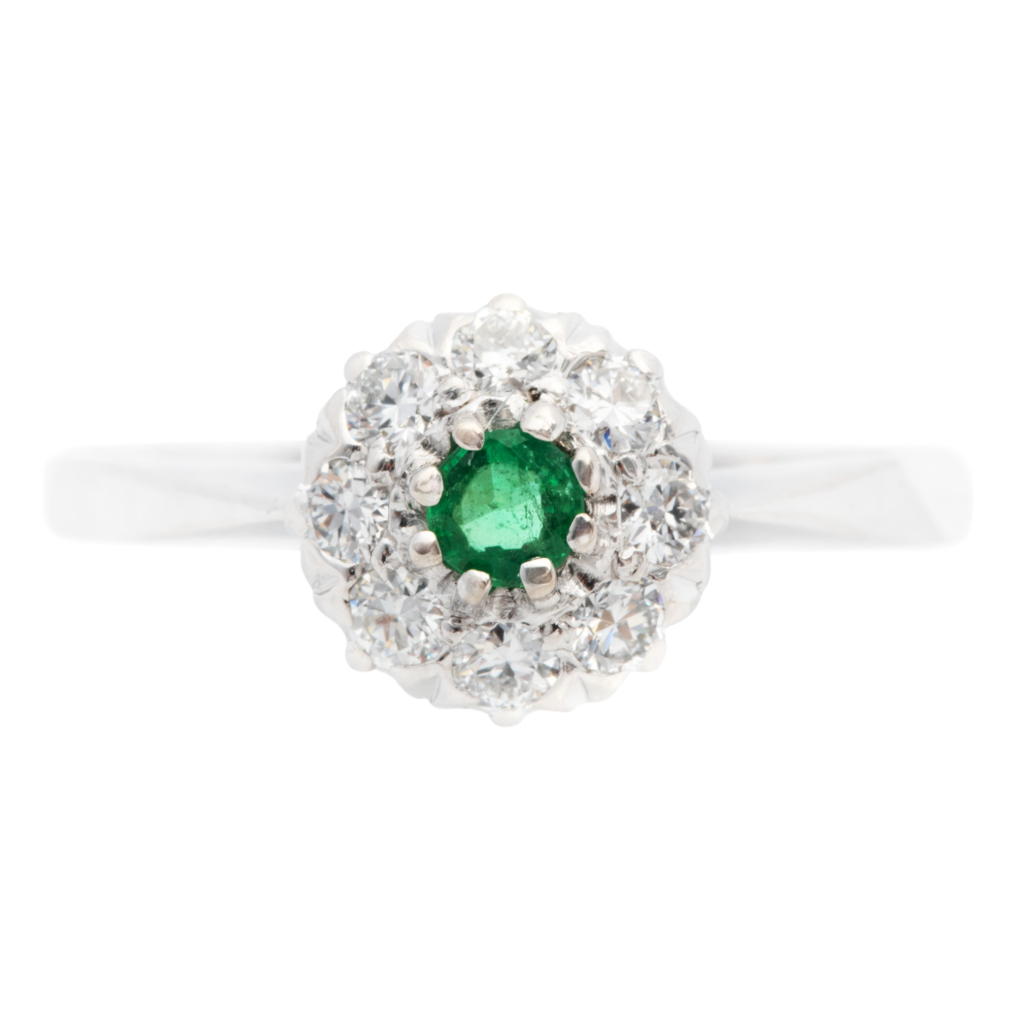 White gold ring, decorated with an emerald and diamonds