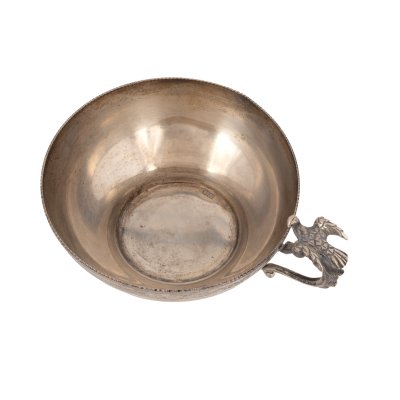 Silver cup with handle, adorned with aviform motif