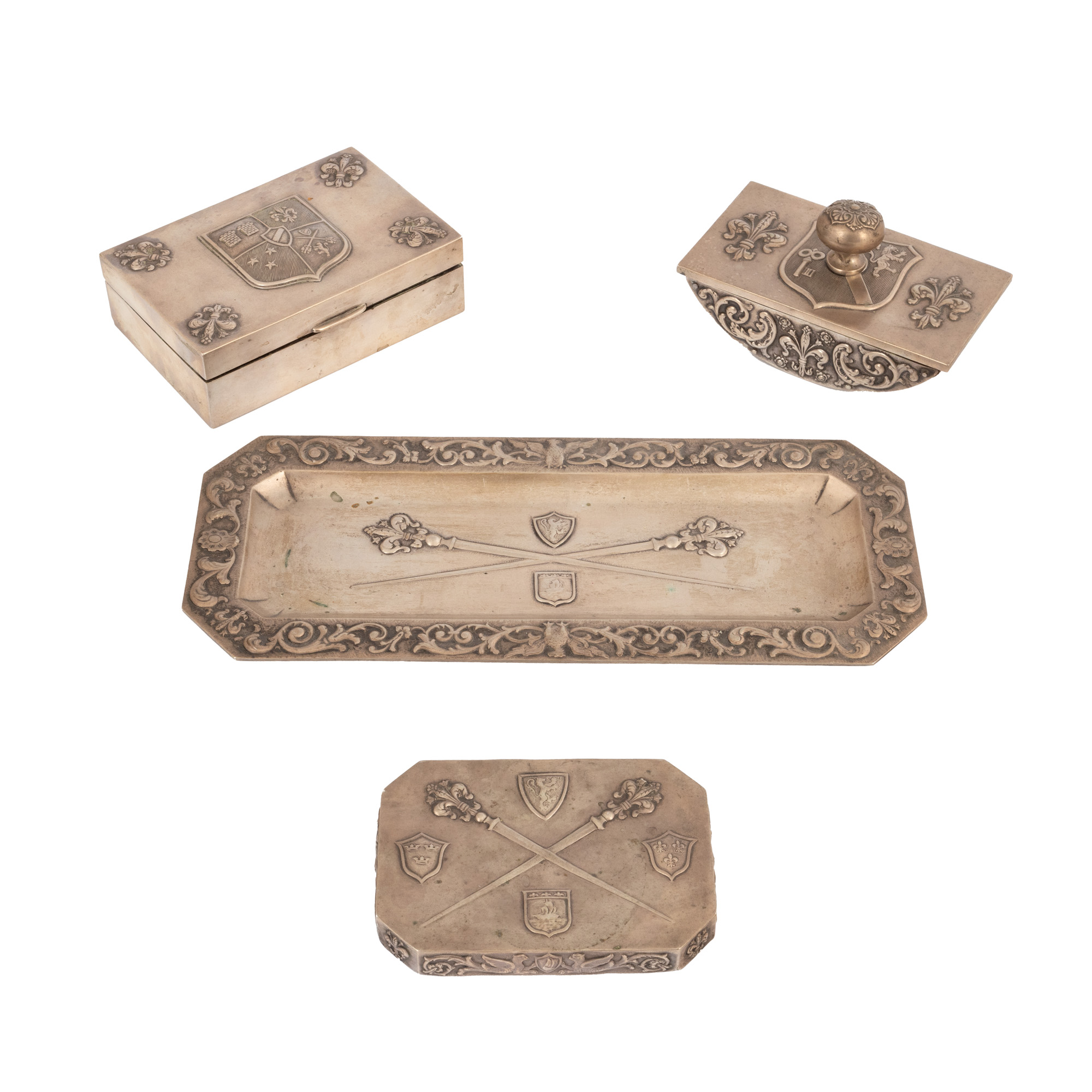 Silver desk set, consisting of tray, mail box, paperweight and blotter, decorated with personal heraldic emblems, circa 1925, handmade