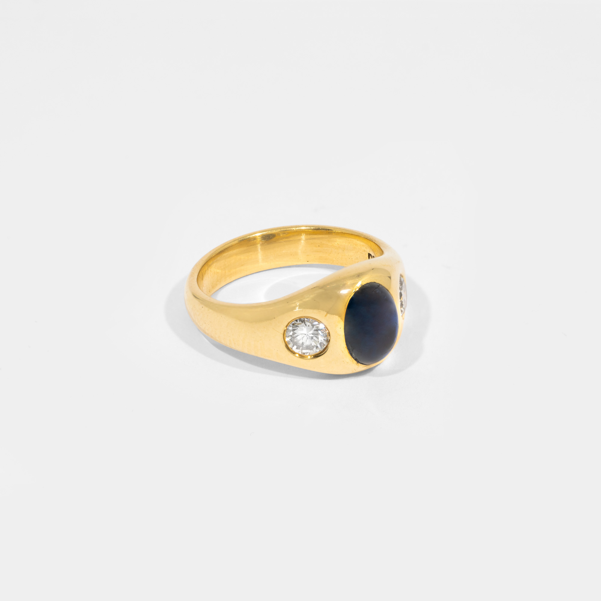 Gold ring, decorated with sapphire and two diamonds