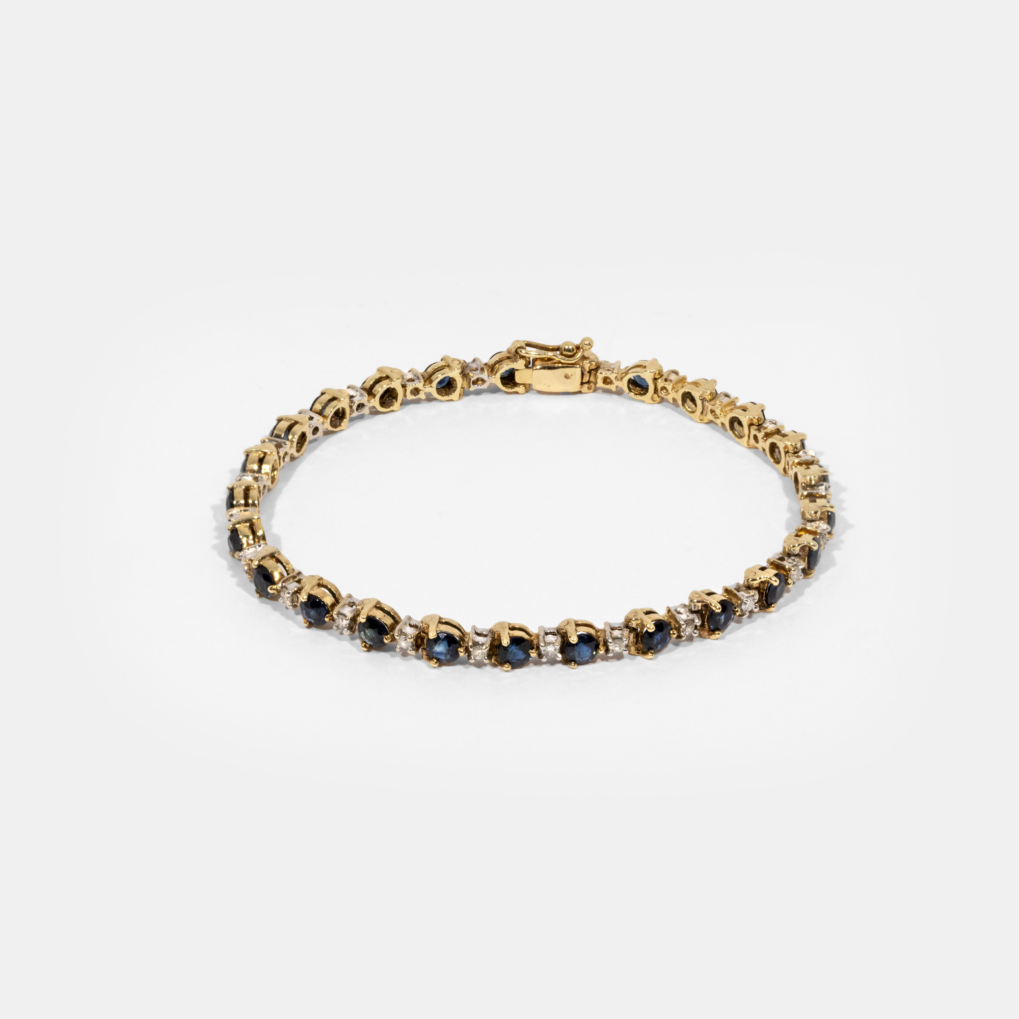 Bicolor gold bracelet, decorated with sapphires and diamonds