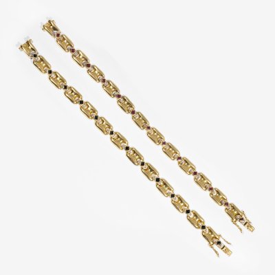Pair of gold bracelets, decorated alternately with rubies and diamonds, sapphires and diamonds.