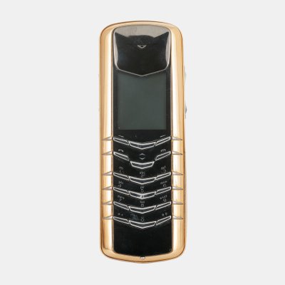 Vertu phone, made of gold, accompanied by charger and car headset