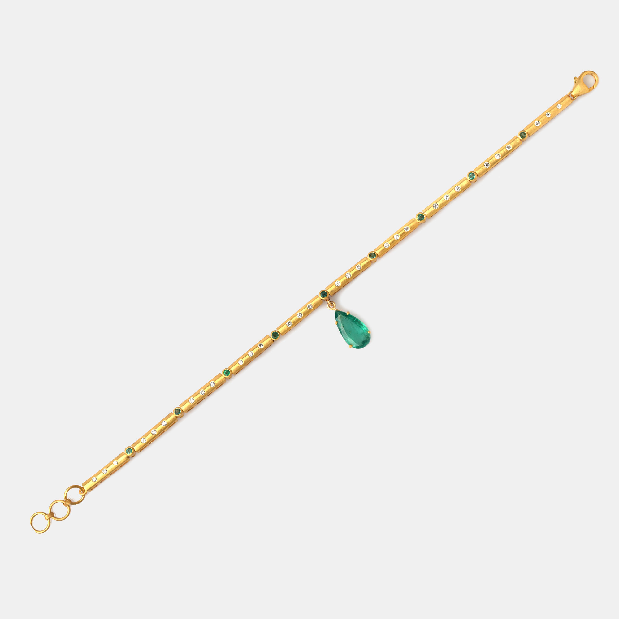Gold bracelet decorated with diamonds and emeralds