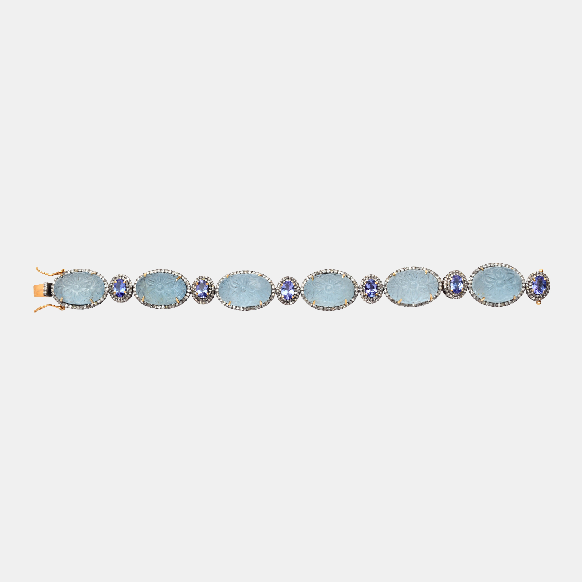 White gold and silver bracelet, adorned with carved aquamarines, tanzanites and diamonds
