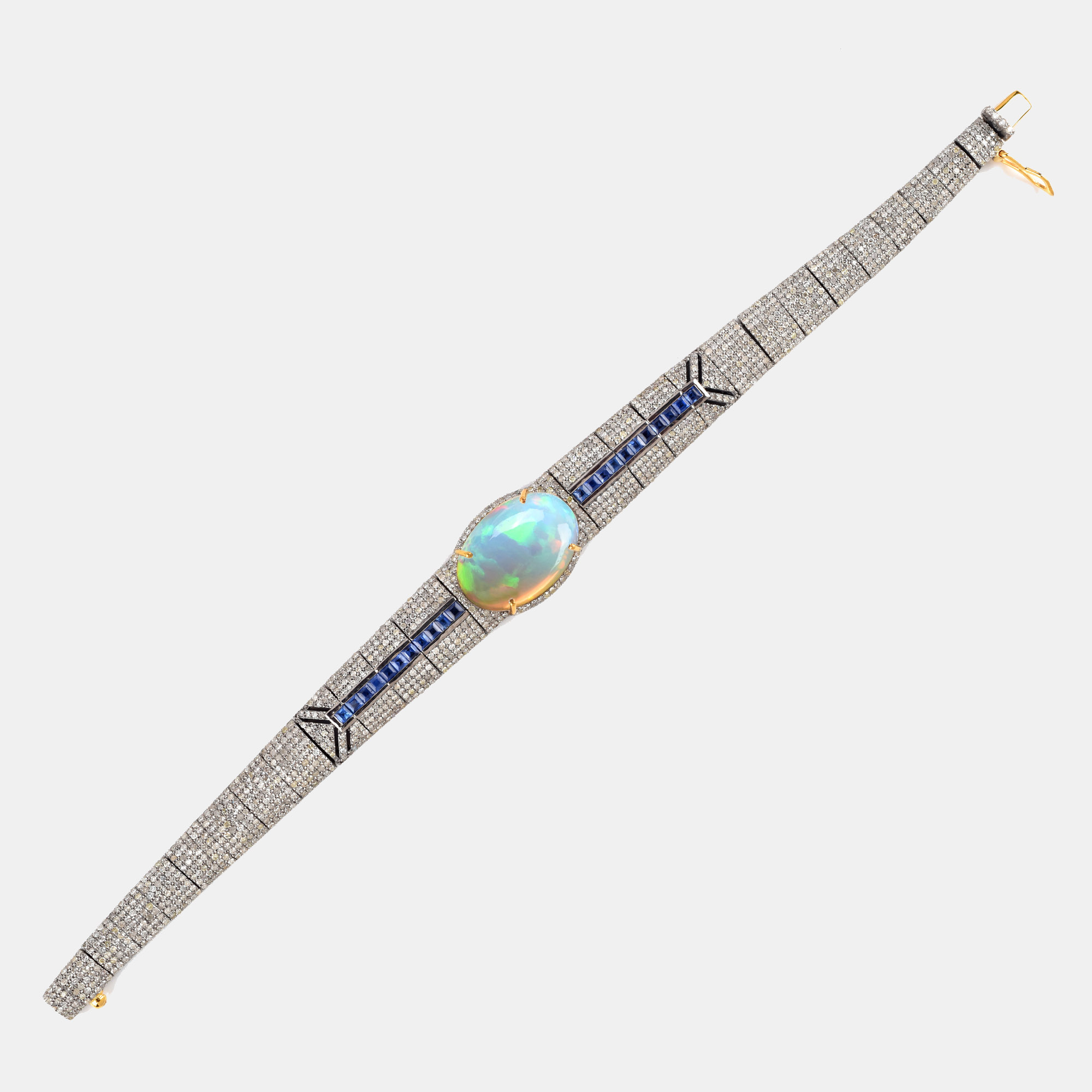 Silver and gold bracelet, adorned with opal, sapphires and diamonds