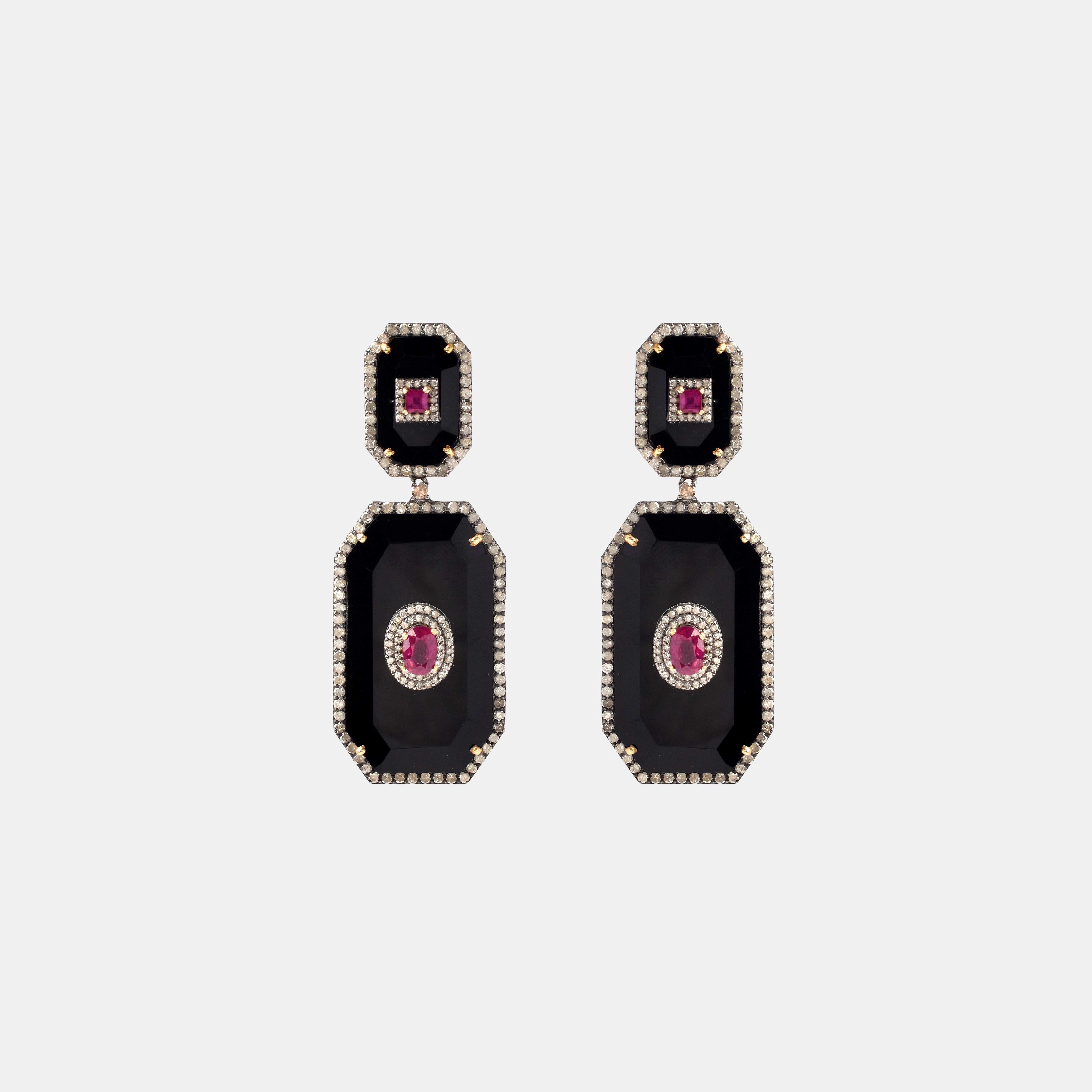 Pair of silver earrings, decorated with onyx, rubies and diamonds