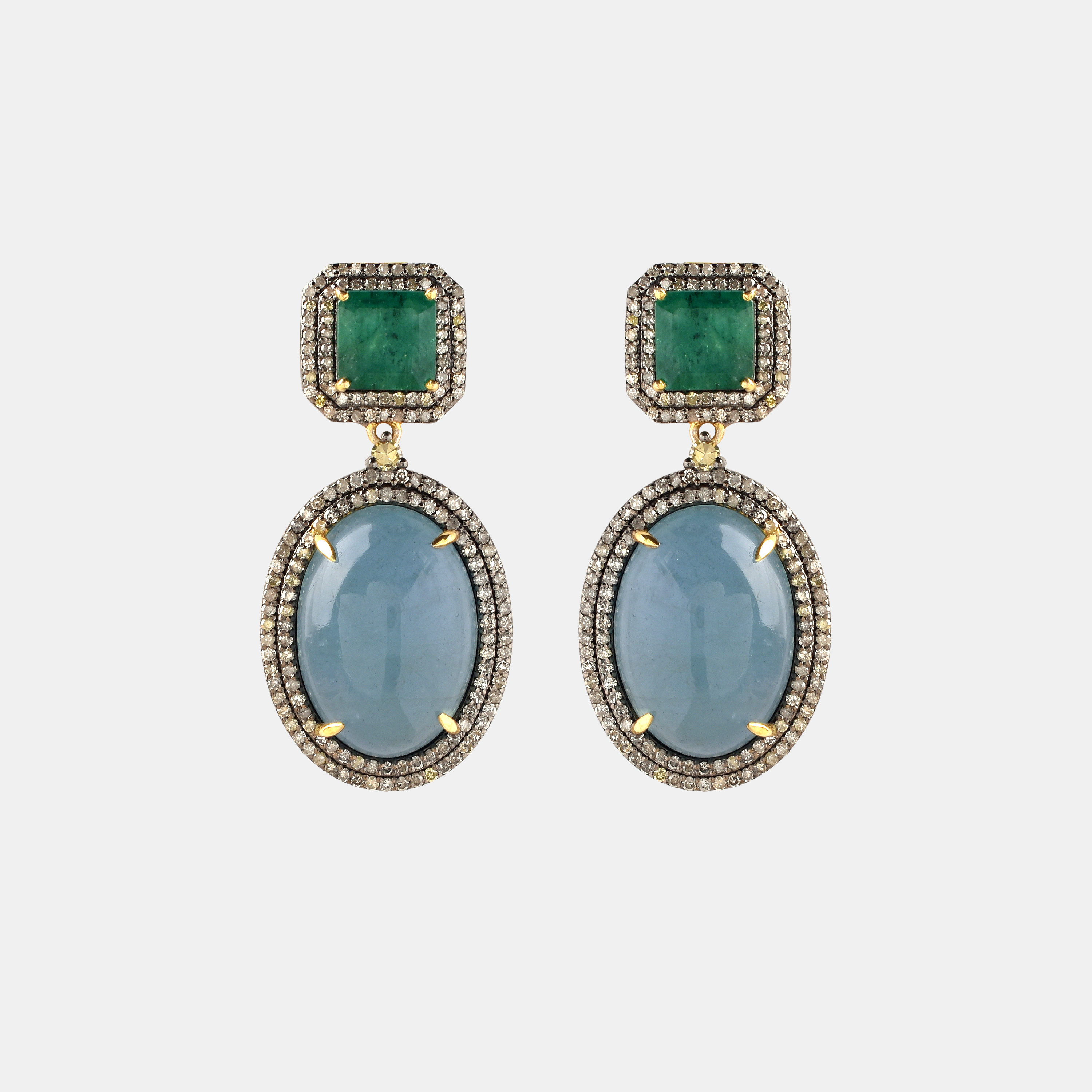 Pair of gold and silver earrings, decorated with aquamarines, emeralds and diamonds