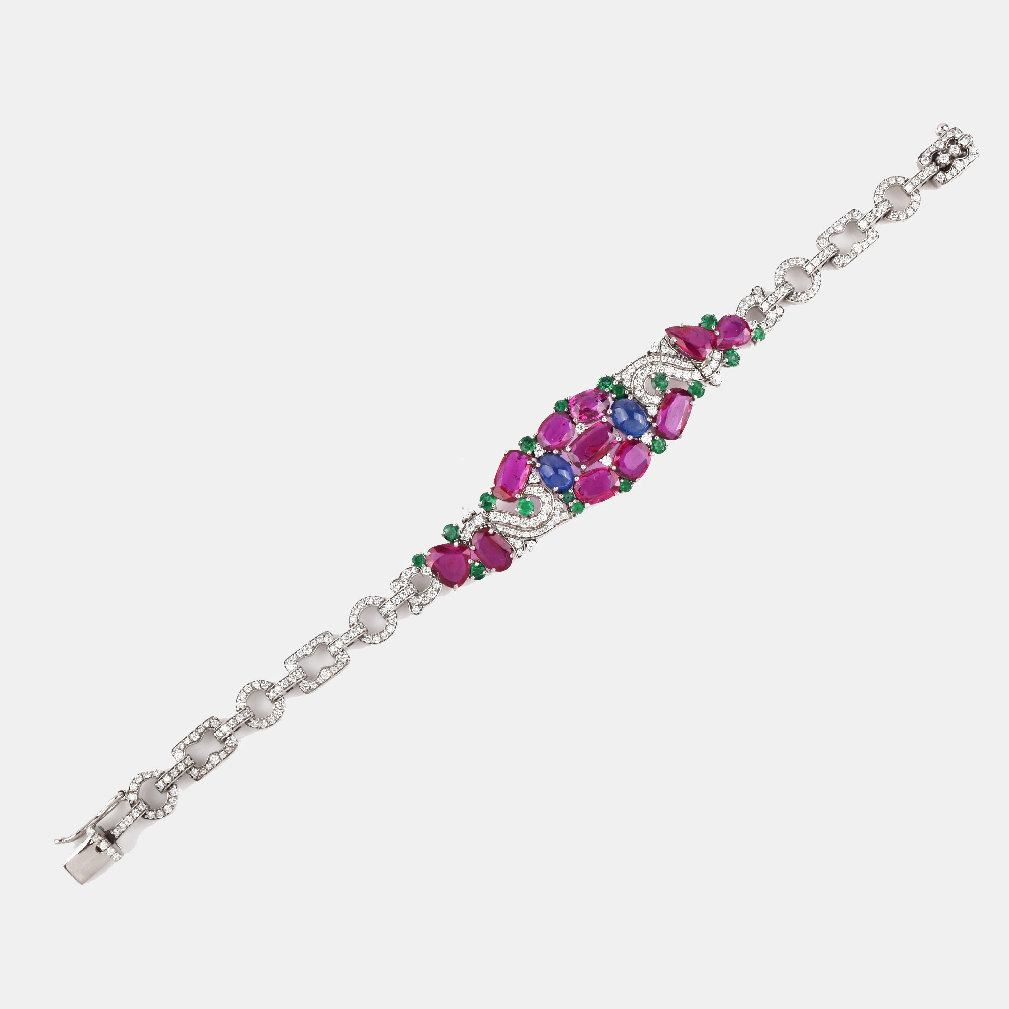 Remarkable white gold bracelet decorated with rubies, sapphires, emeralds and diamonds