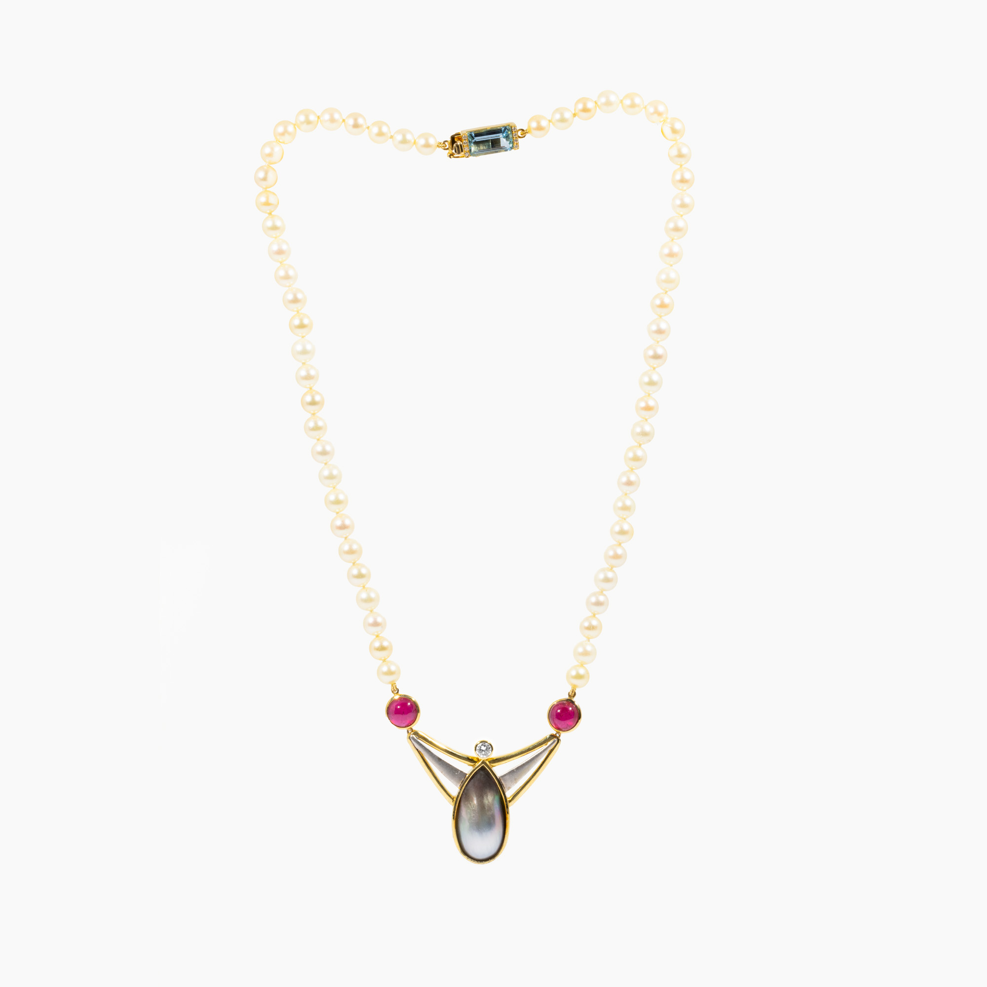 Pearl necklace, decorated with diamond, aquamarine, mother-of-pearl and cabochon rubies