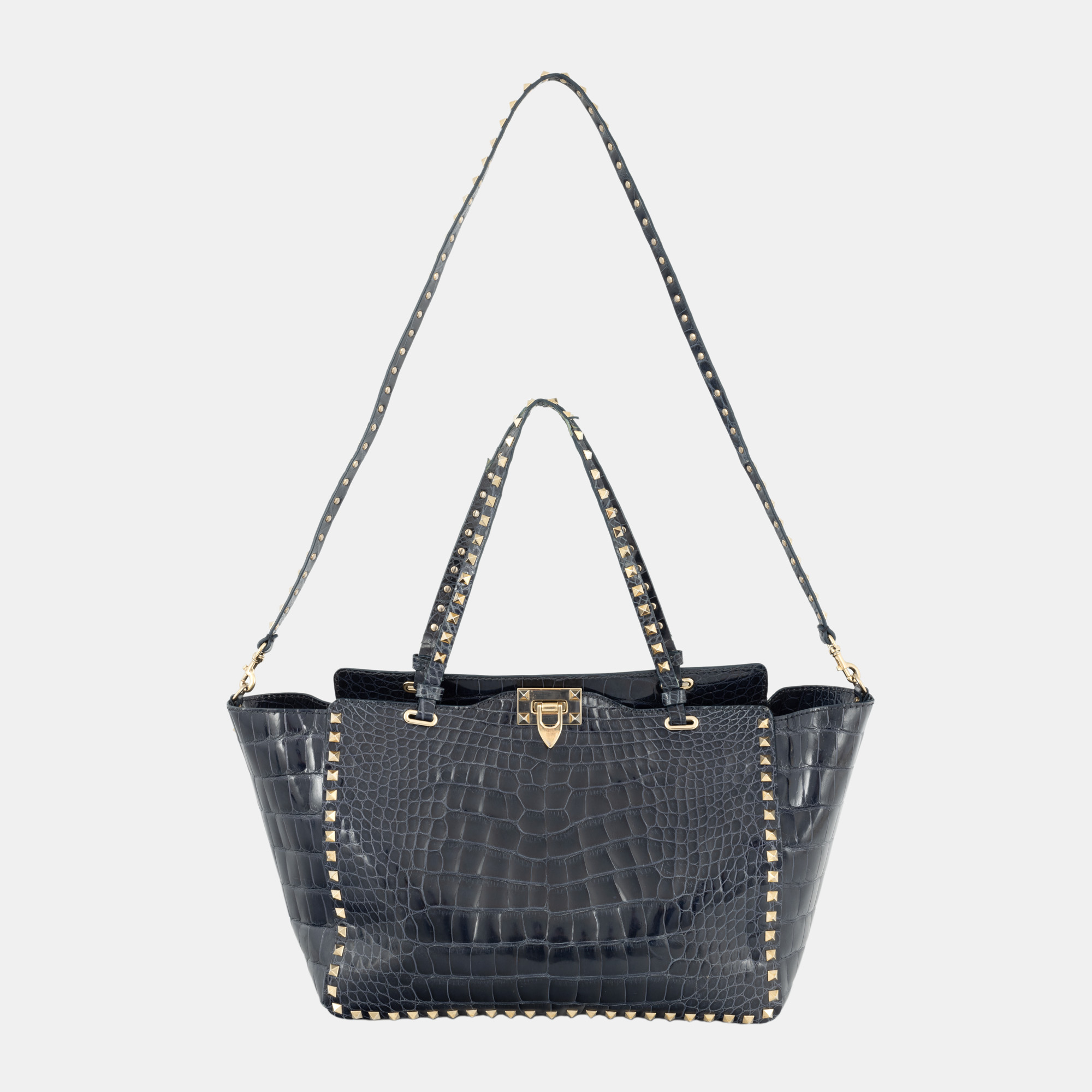 "Rockstud" - Valentino bag, made of crocodile skin, accompanied by a rain cape