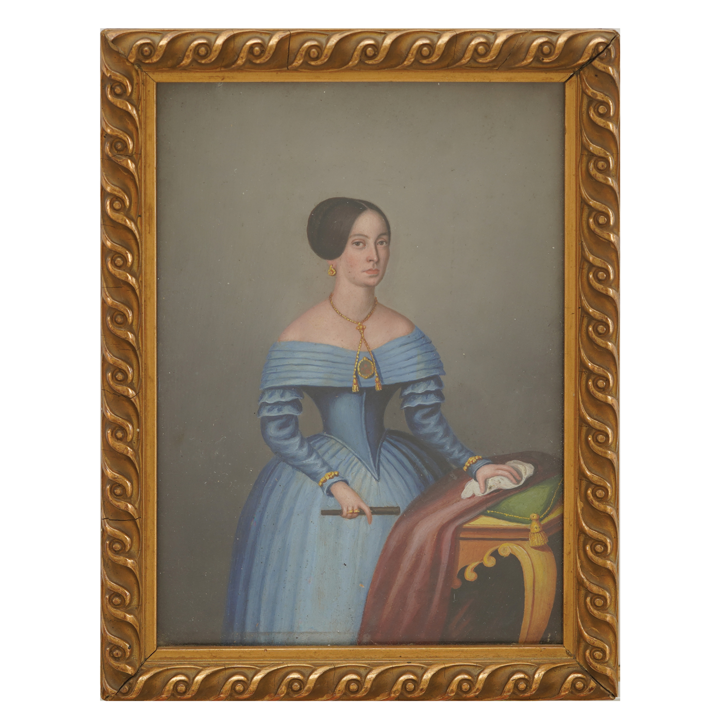 Figure of a woman in a light blue dress, standing next to the table