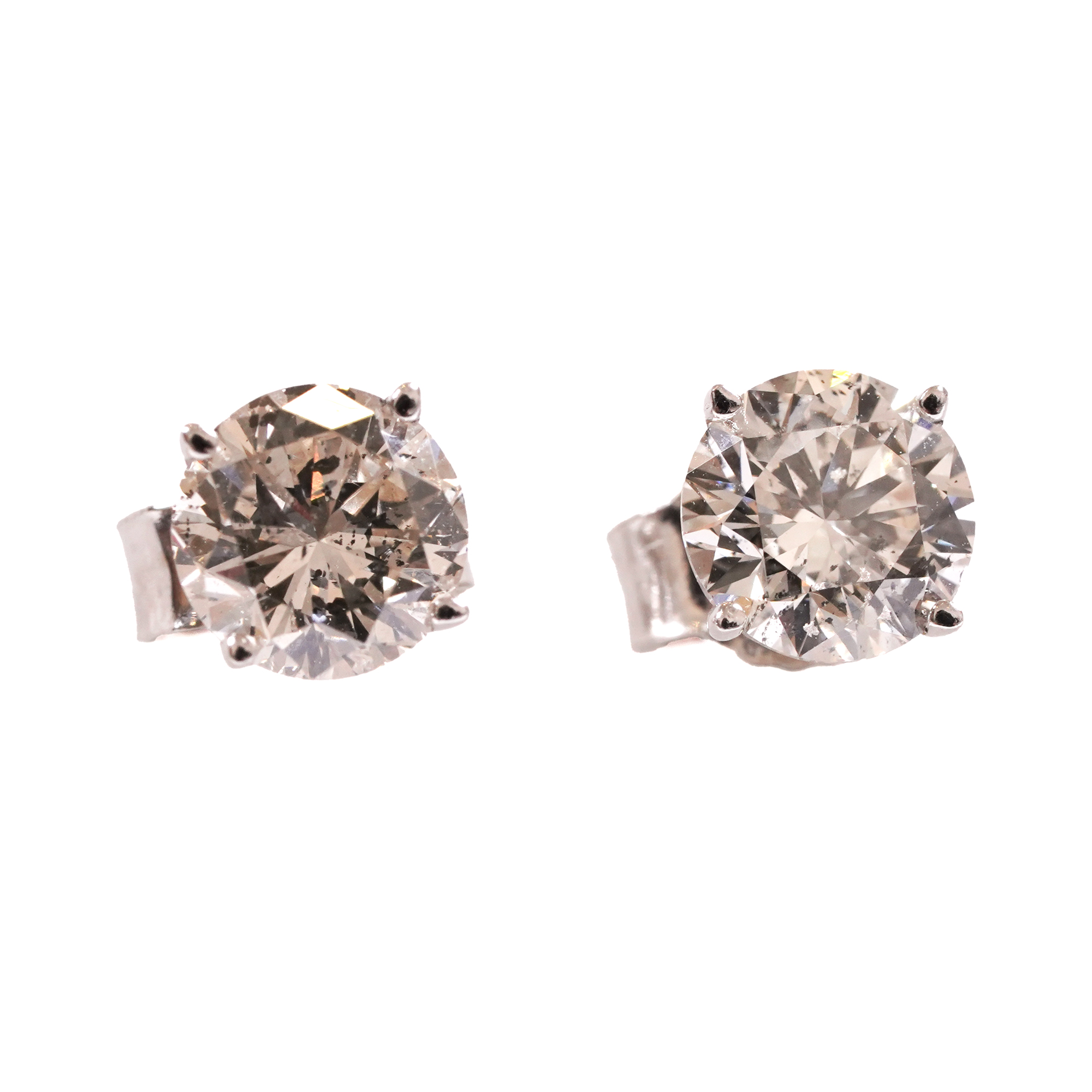 A pair of white gold earrings decorated with solitaire diamonds