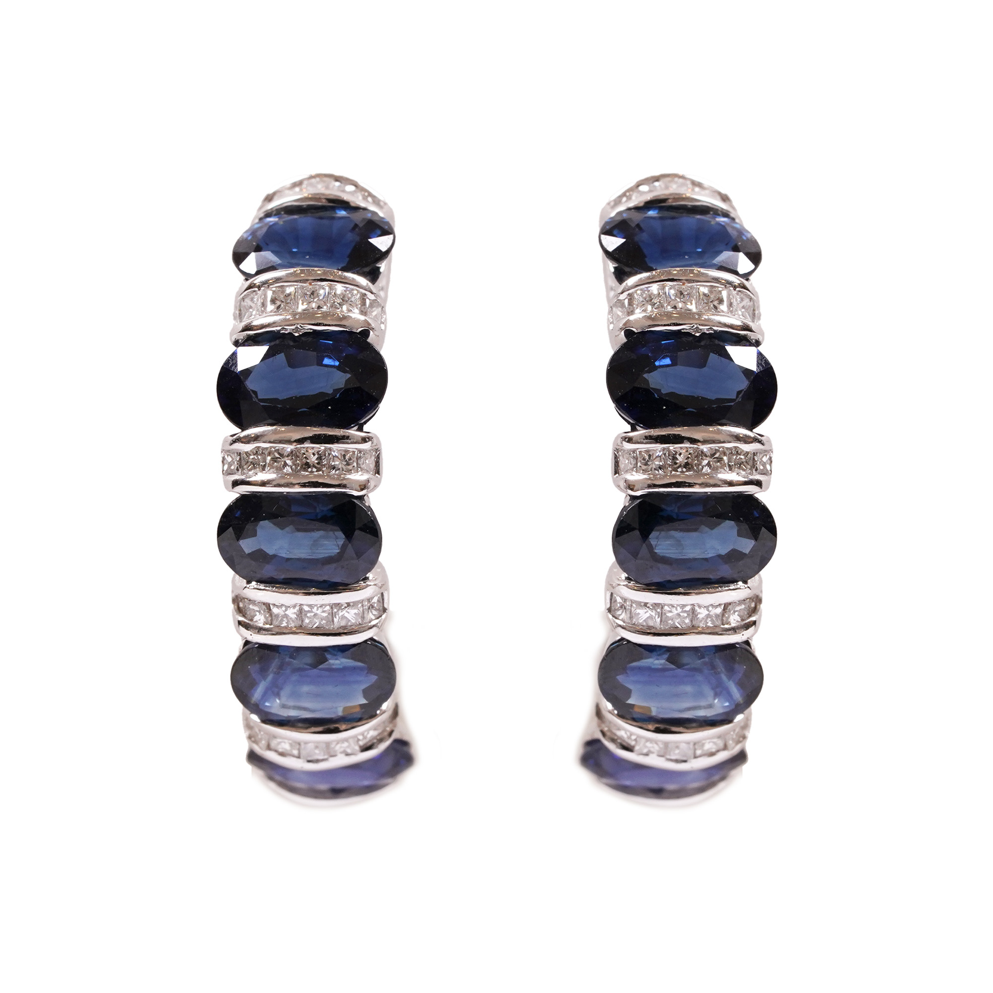 A pair of white gold earrings decorated with sapphires and diamonds