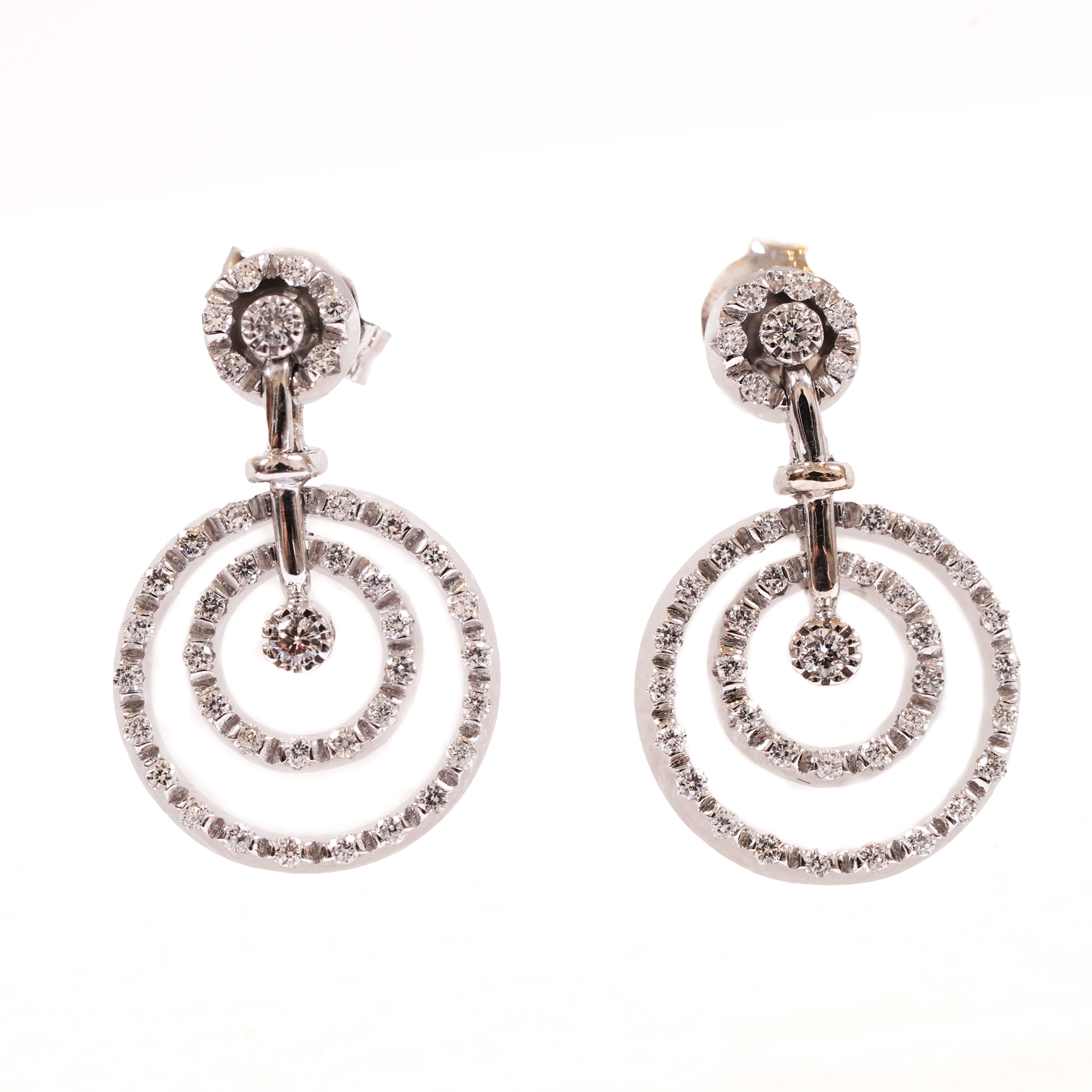 A pair of white gold earrings decorated with diamonds