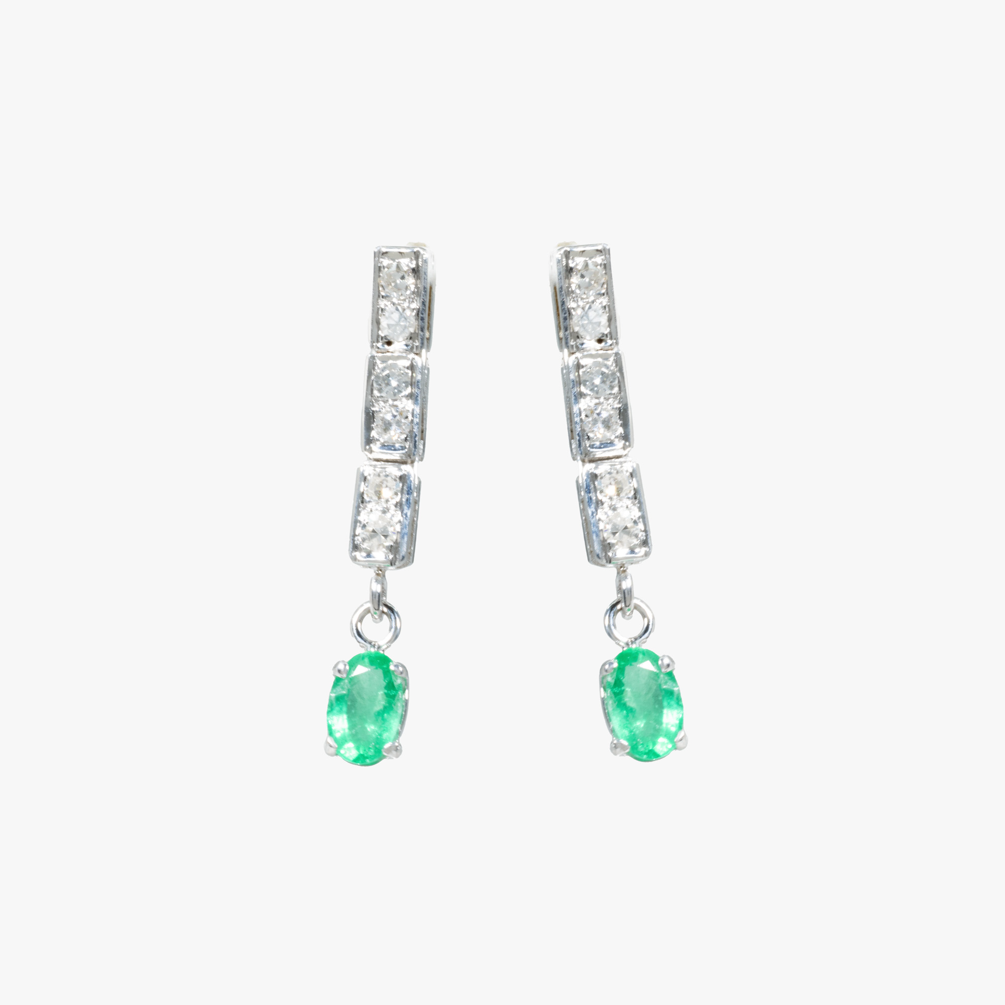 Pair of white gold earrings, decorated with diamonds and emeralds