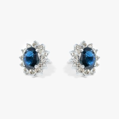 Pair of white gold earrings, adorned with sapphires surrounded by diamonds