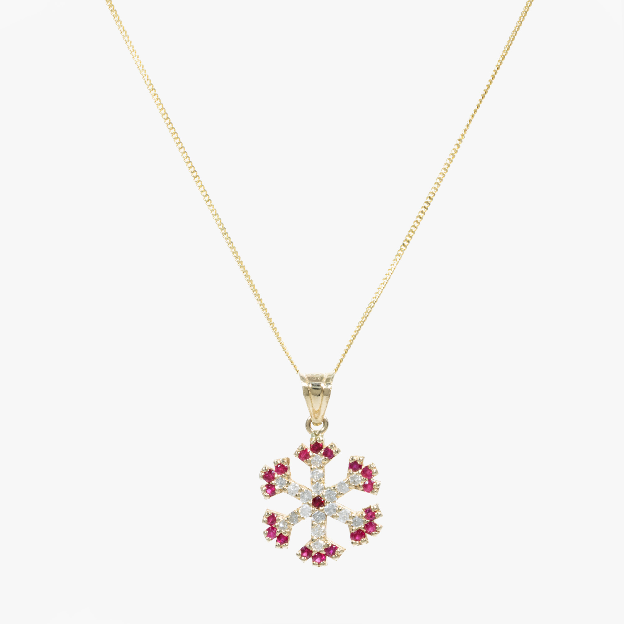 Gold chain with snowflake pendant, decorated with rubies and diamonds