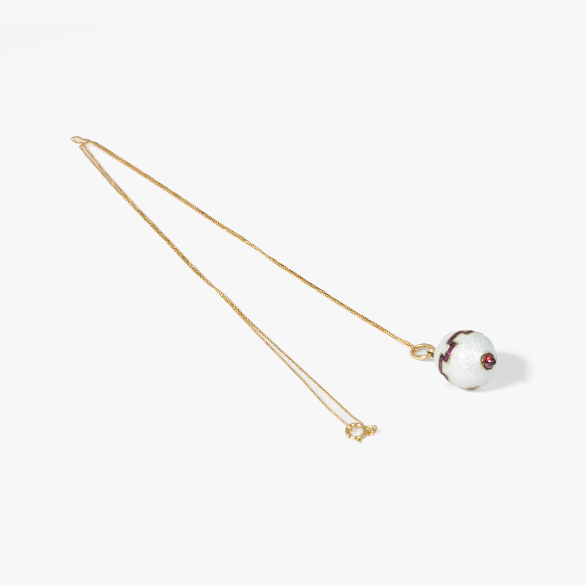 Gold chain with pendant, decorated with guilloché enamel, garnet and fancy brown diamonds, cca. 1910