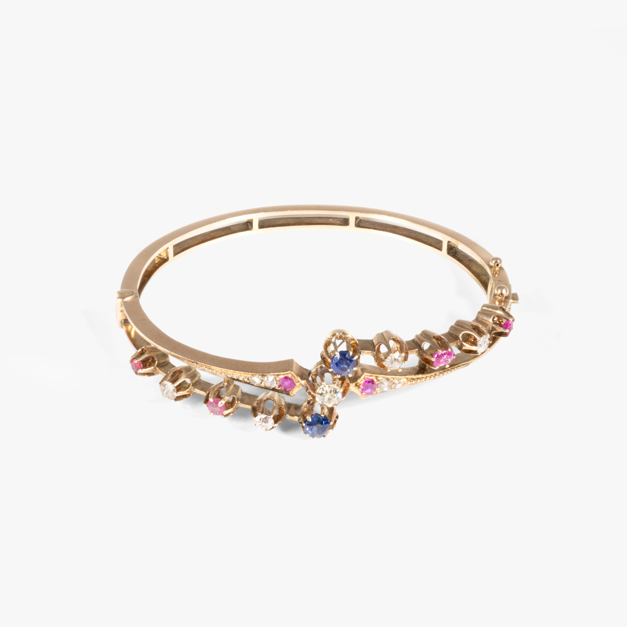 Belle Epoque style bracelet in red gold, decorated with sapphires, rubies and diamonds, circa 1926