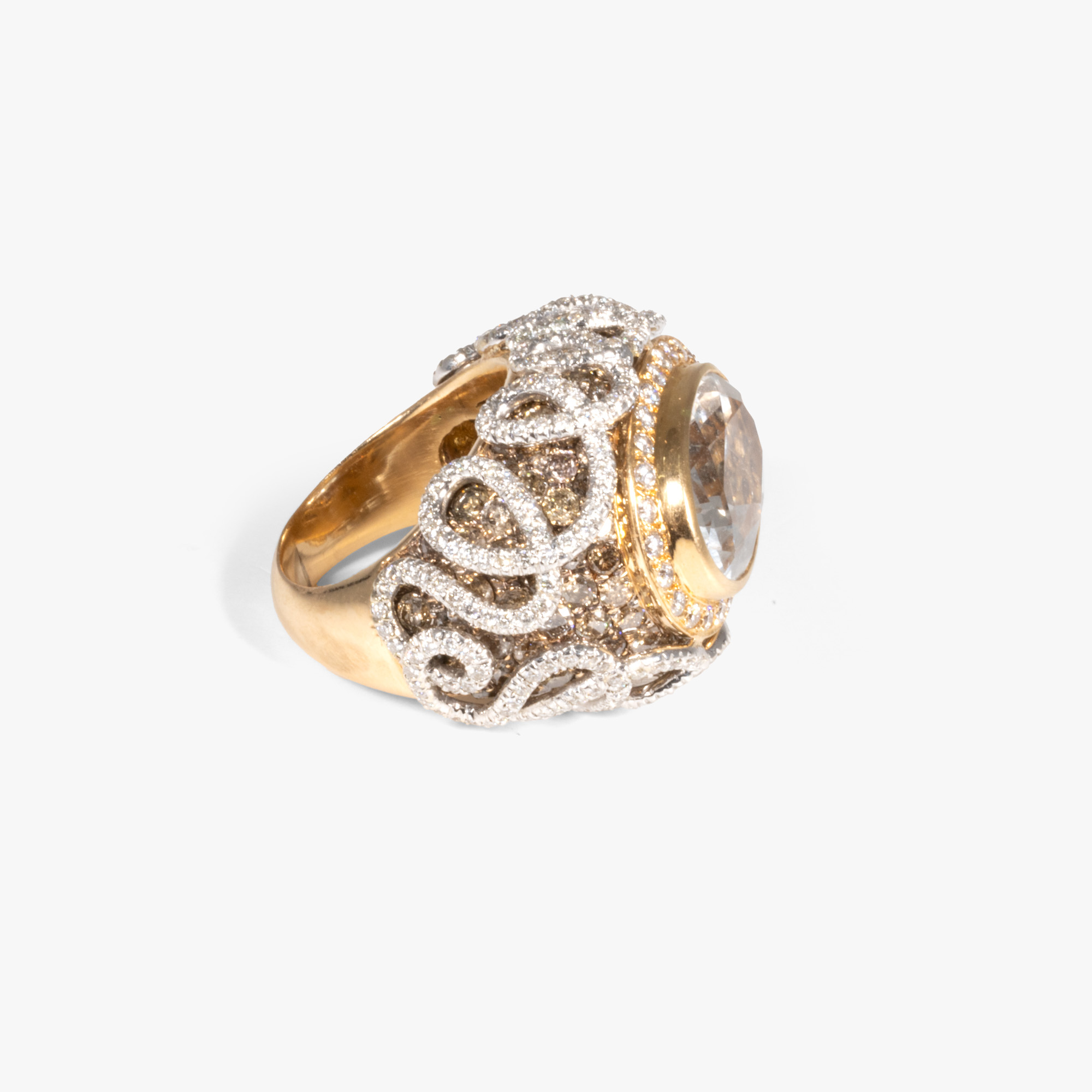 Bicolor gold ring, adorned with a central topaz and diamond pavement