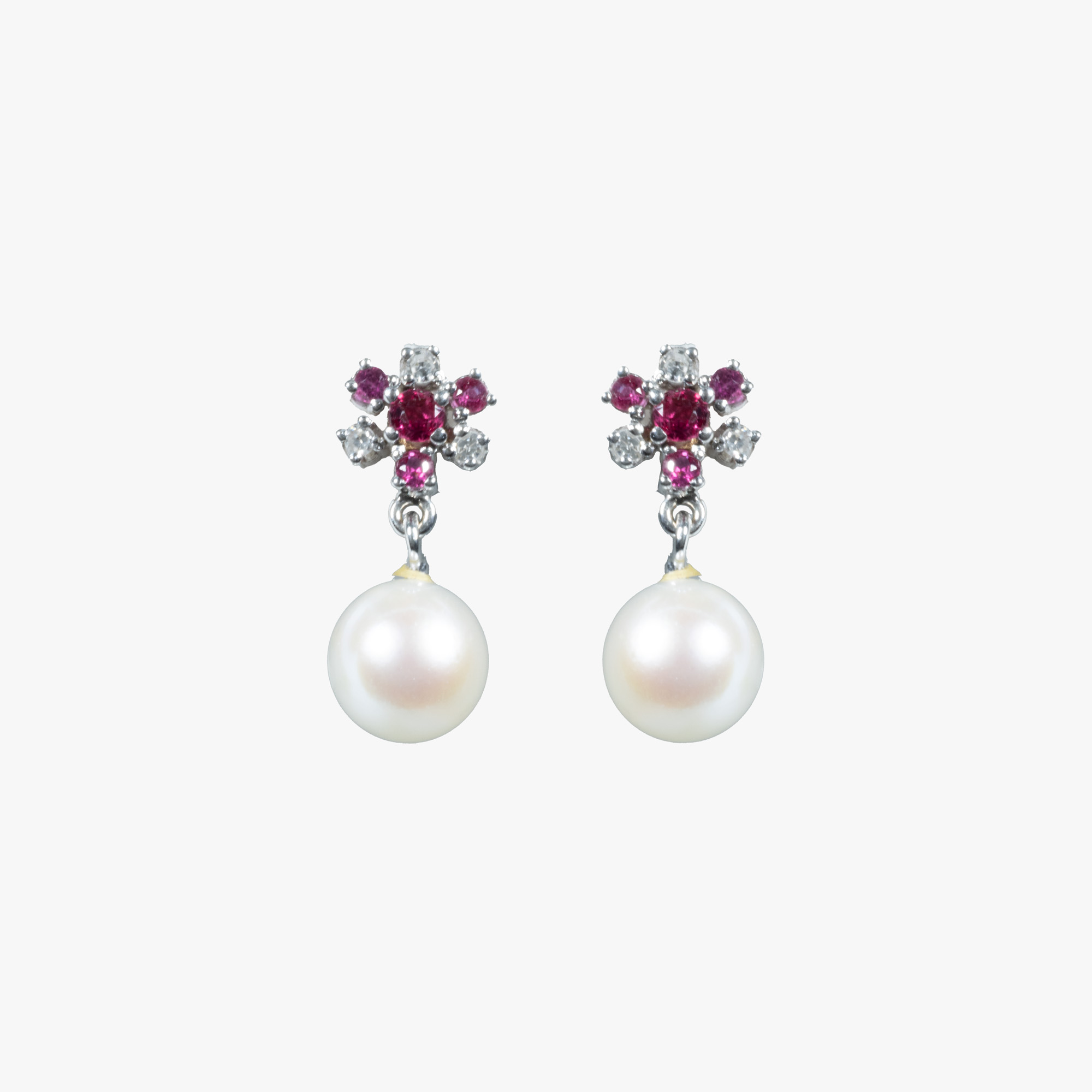 Pair of white gold earrings, decorated with pearls, diamonds and rubies
