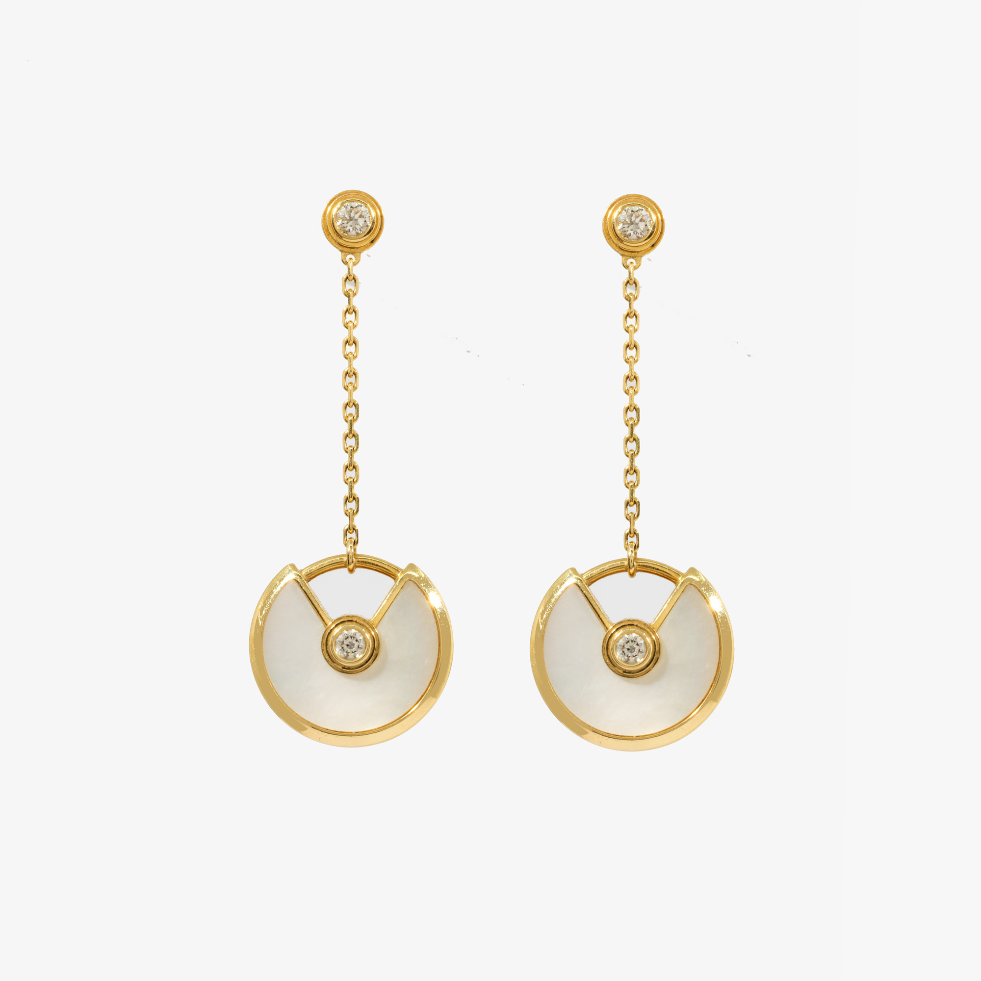 "Amulette" - pair of Cartier earrings, made of gold, decorated with diamonds and mother of pearl, accompanied by the original box