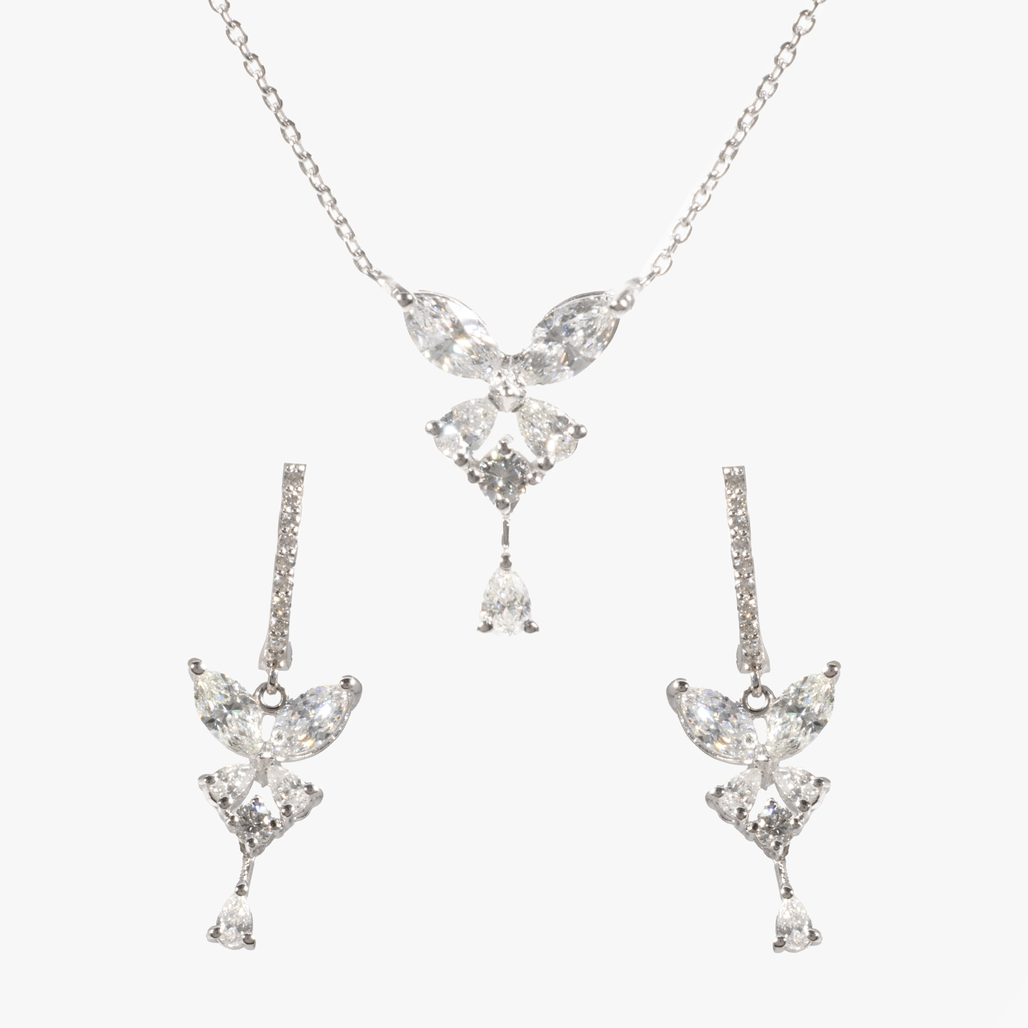 White gold set, consisting of pendant necklace and earrings, decorated with diamonds
