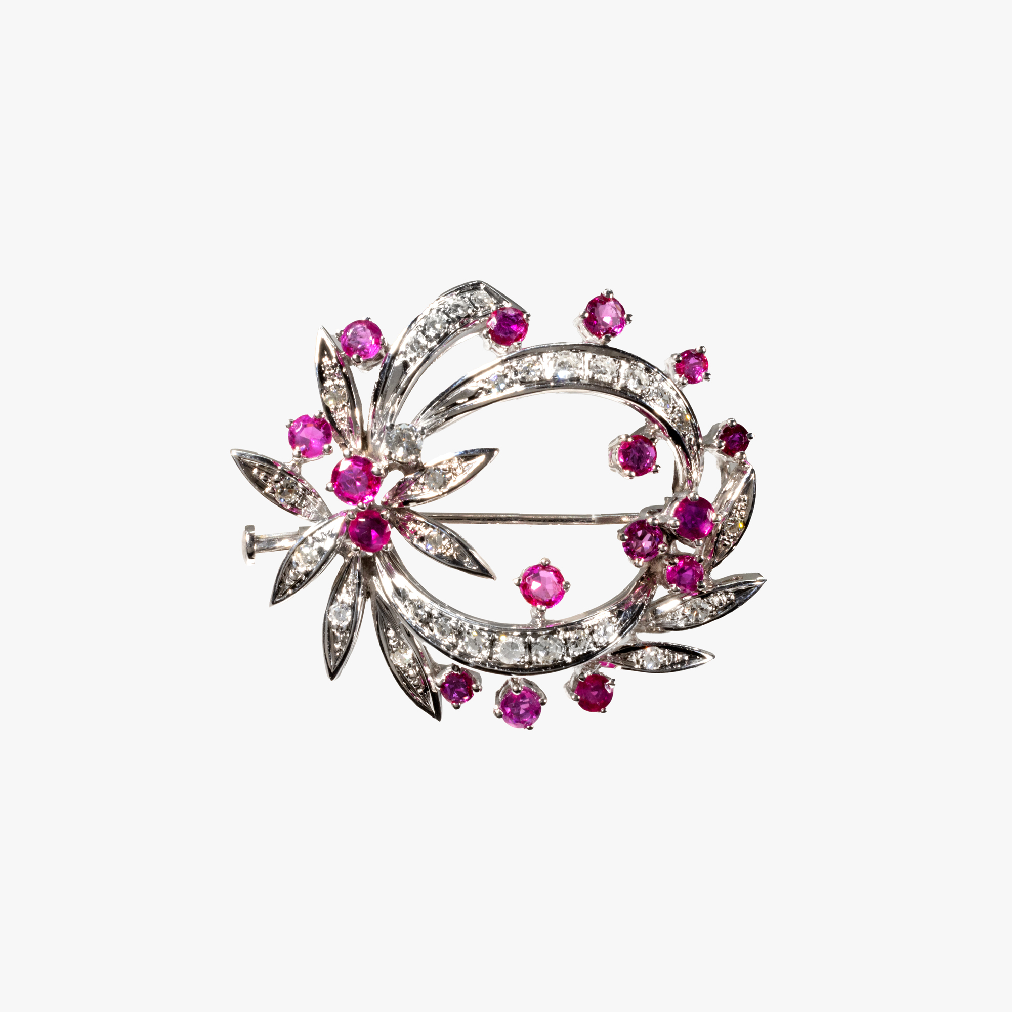 White gold brooch, decorated with rubies and diamonds, accompanied by additional gemological certificate