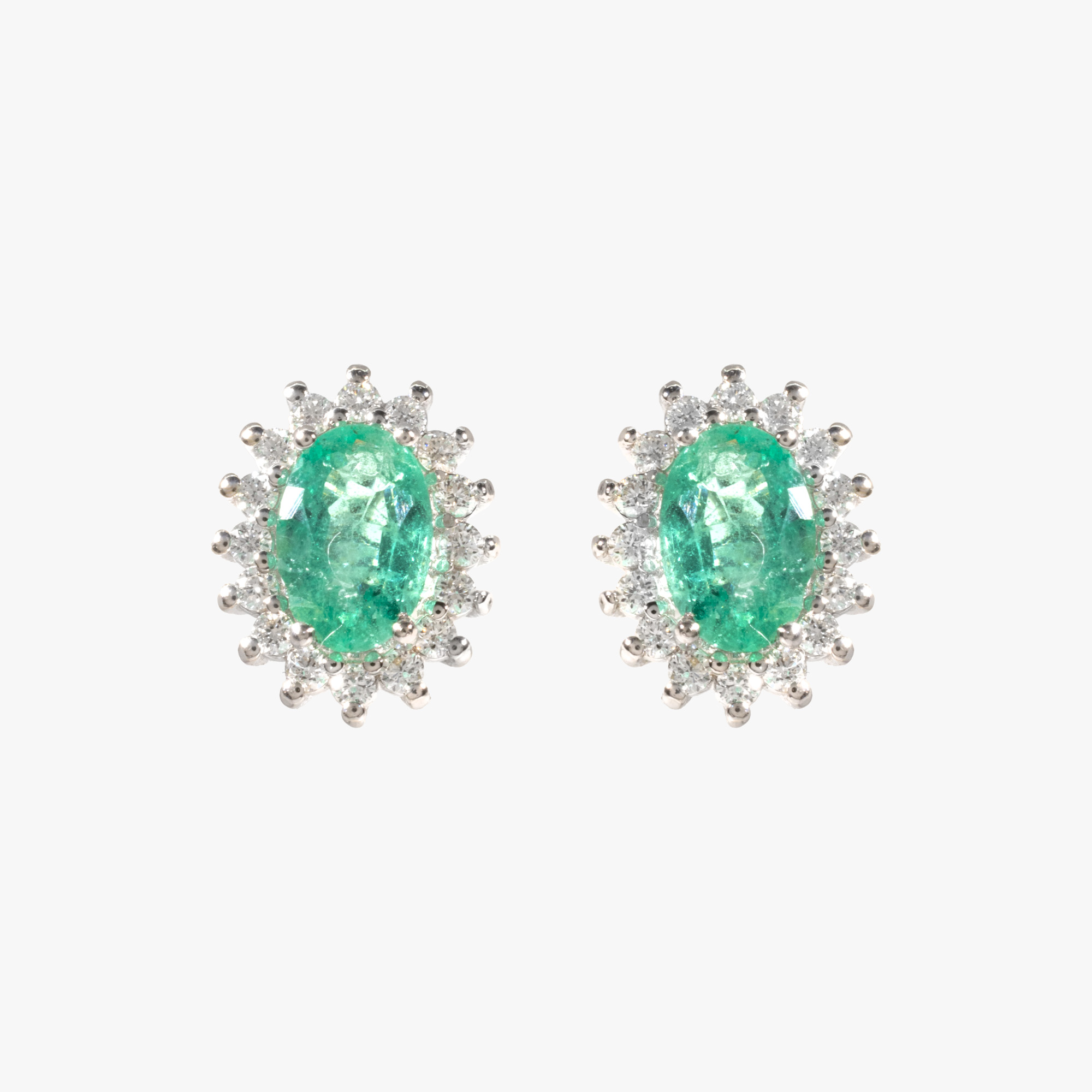 Pair of white gold earrings, decorated with emeralds and diamond entourage